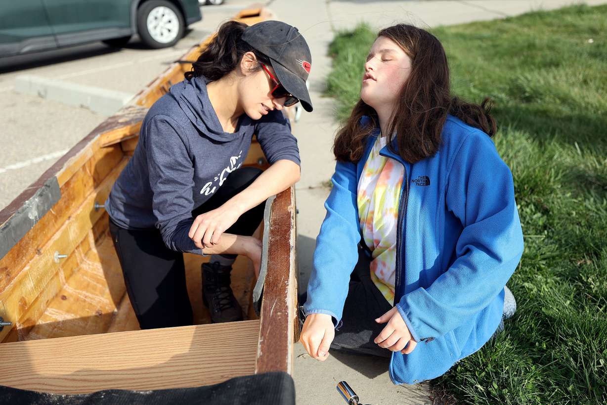 Michelle Ward, a preschool teacher with the Utah Schools for the Deaf and the Blind, left, and Emily Groves, a freshman at the schools, put a boat together at Pelican Beach in Willard Bay in Willard, Box Elder County, on April 29. Students and faculty from the schools, and some support friends, are doing an overnight paddle mission to train for the SEVENTY48, an upcoming 70-mile boat race between Tacoma and Port Townsend, Wash., that has to be completed in 48 hours.