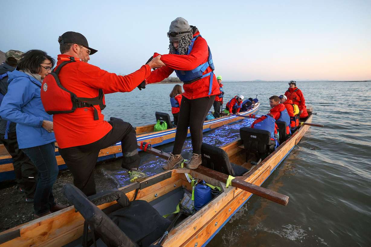 Darren Anderson, left, helps Erica Emery, a legally blind sophomore with oculocutaneous albinism, navigate her way off a boat at Pelican Beach at Willard Bay in Willard, Box Elder County on April 29. Students and faculty from the Utah Schools for the Deaf and the Blind, and some support friends, are doing an overnight paddle mission to train for the SEVENTY48, an upcoming 70-mile boat race between Tacoma and Port Townsend, Wash., that has to be completed in 48 hours.