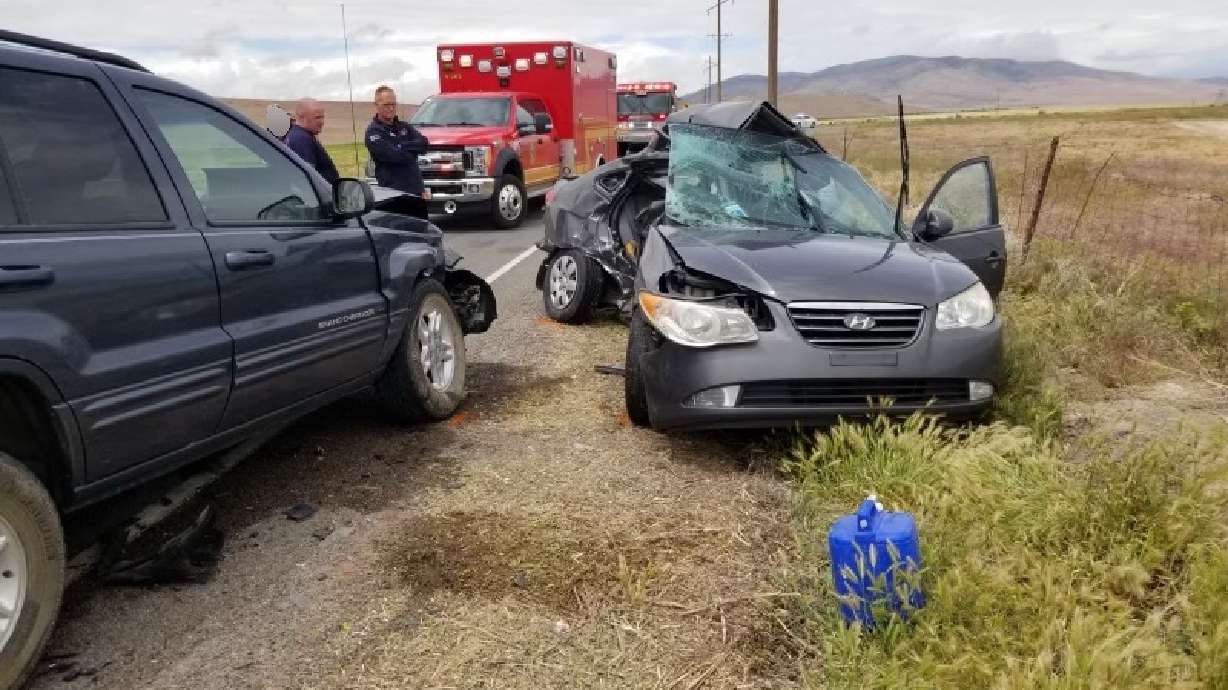 Two people died Saturday when the Hyundai passenger car they were in crossed into oncoming traffic on Redwood Road in Utah County and got hit by a Jeep.