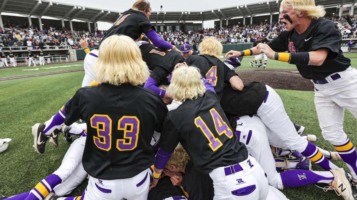 Lehi celebrates winning the 5A baseball championships over Olympus at UCCU Ballpark in Orem, Utah on Saturday, May 28, 2022.