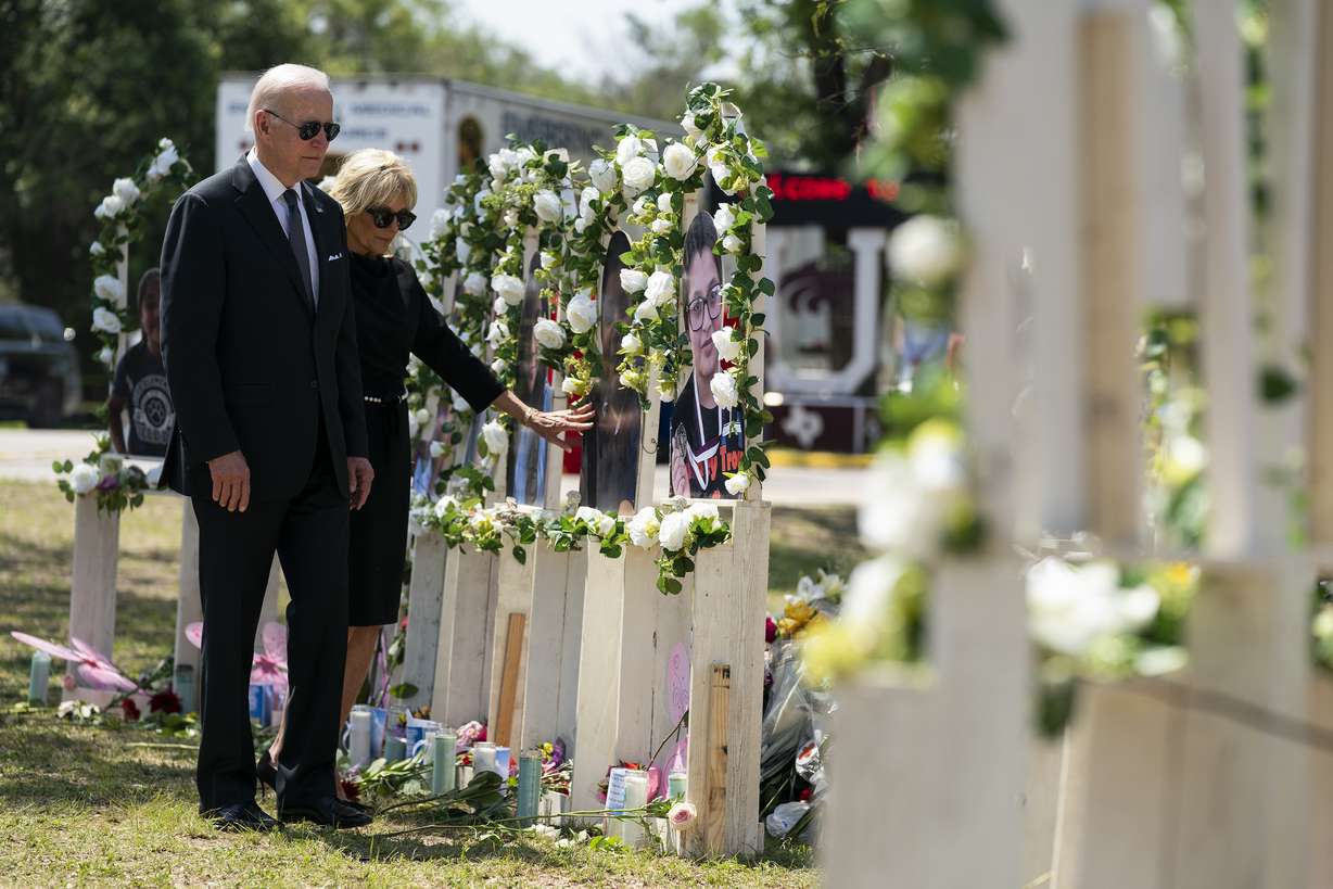 President Joe Biden and first lady Jill Biden visit a memorial at Robb Elementary School to pay their respects to the victims of the mass shooting, Sunday, in Uvalde, Texas.