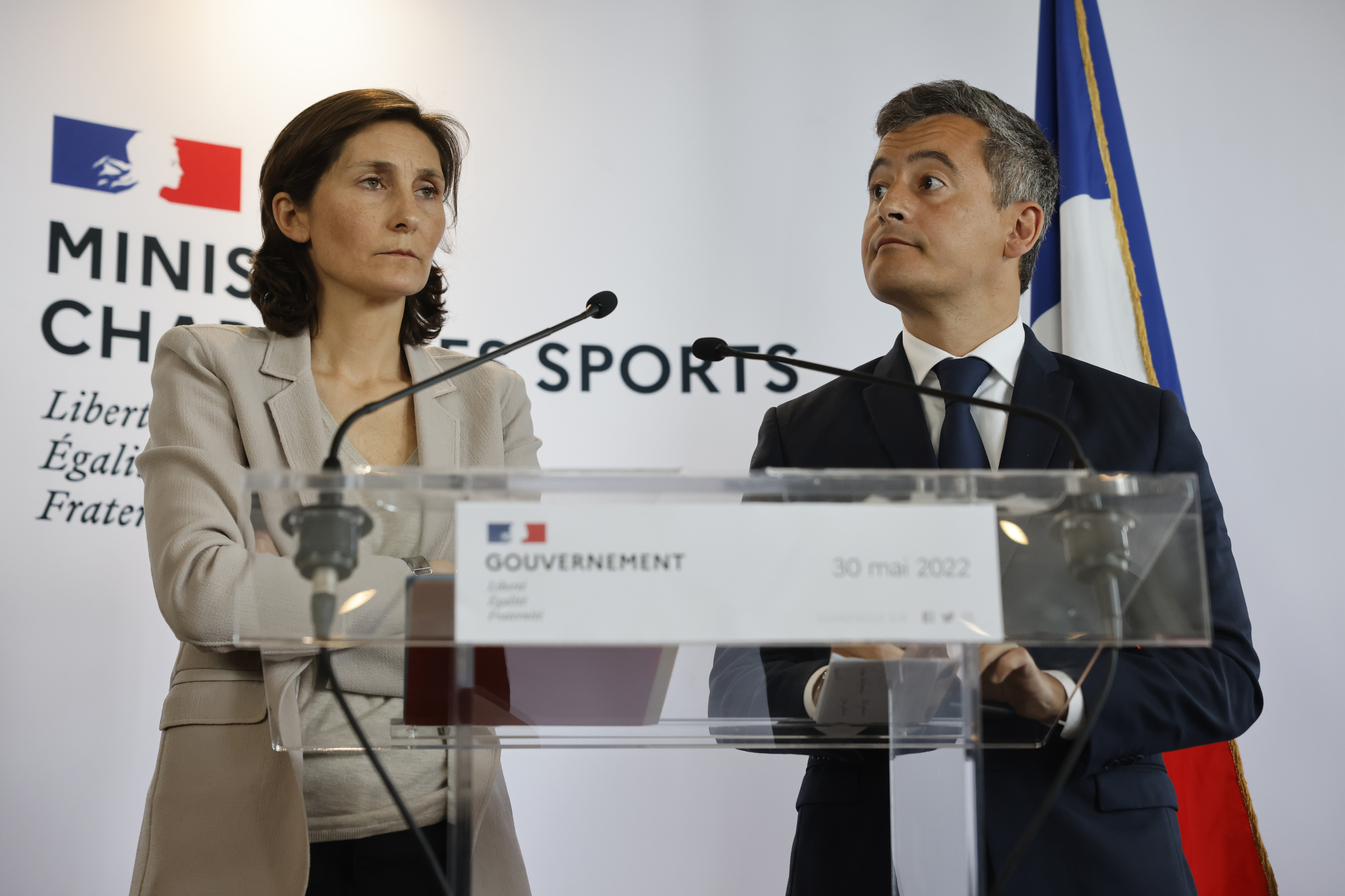 Sports Minister Amélie Oudéa-Castéra, left, and French Interior Minister Gerald Darmanin attend a press conference following a meeting on security after incidents during the Champions League final at the Stade France stadium, Monday, May 30, 2022 in Paris. The British government says it's deeply concerned over the treatment of Liverpool supporters by French authorities, who blamed fans for unrest at the Champions League final amid overcrowding outside the Stade de France. 