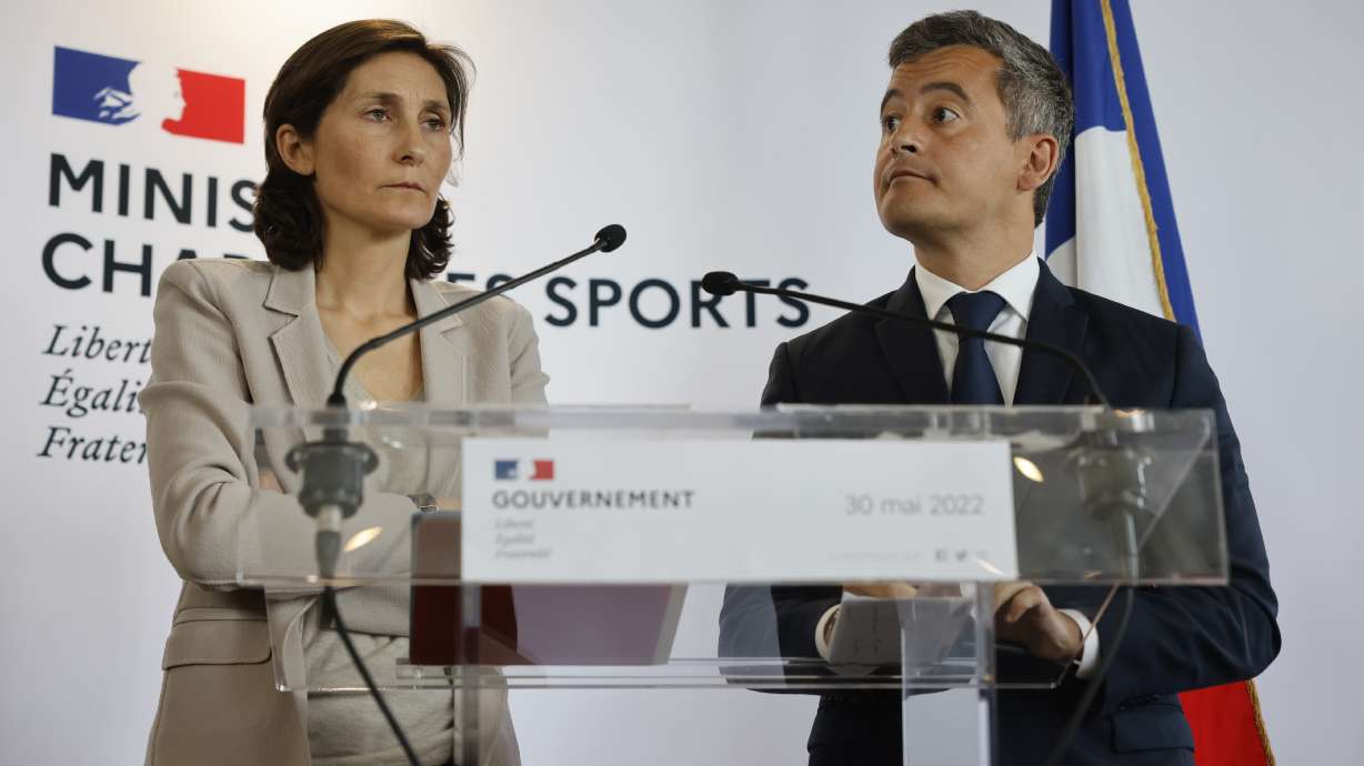 Sports Minister Amélie Oudéa-Castéra, left, and French Interior Minister Gerald Darmanin attend a press conference following a meeting on security after incidents during the Champions League final at the Stade France stadium, Monday, May 30, 2022 in Paris. The British government says it's deeply concerned over the treatment of Liverpool supporters by French authorities, who blamed fans for unrest at the Champions League final amid overcrowding outside the Stade de France.