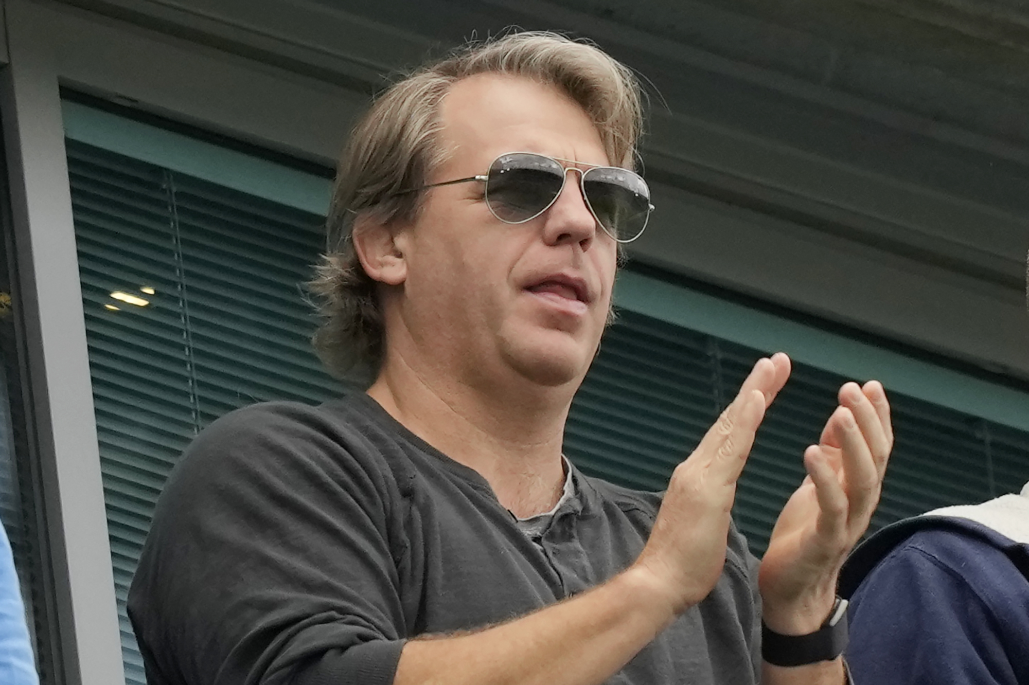 FILE -  American businessman Todd Boehly applauds during the English Premier League soccer match between Chelsea and Wolverhampton at Stamford Bridge stadium, in London, Saturday, May 7, 2022. The Premier League has approved the proposed sale of Chelsea to a consortium fronted by Los Angeles Dodgers part-owner Todd Boehly, although the U.K. government still needs to sign off on the deal before it can be completed. 