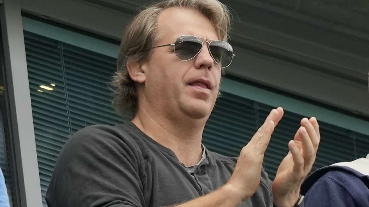 FILE - American businessman Todd Boehly applauds during the English Premier League soccer match between Chelsea and Wolverhampton at Stamford Bridge stadium, in London, Saturday, May 7, 2022. The Premier League has approved the proposed sale of Chelsea to a consortium fronted by Los Angeles Dodgers part-owner Todd Boehly, although the U.K. government still needs to sign off on the deal before it can be completed.