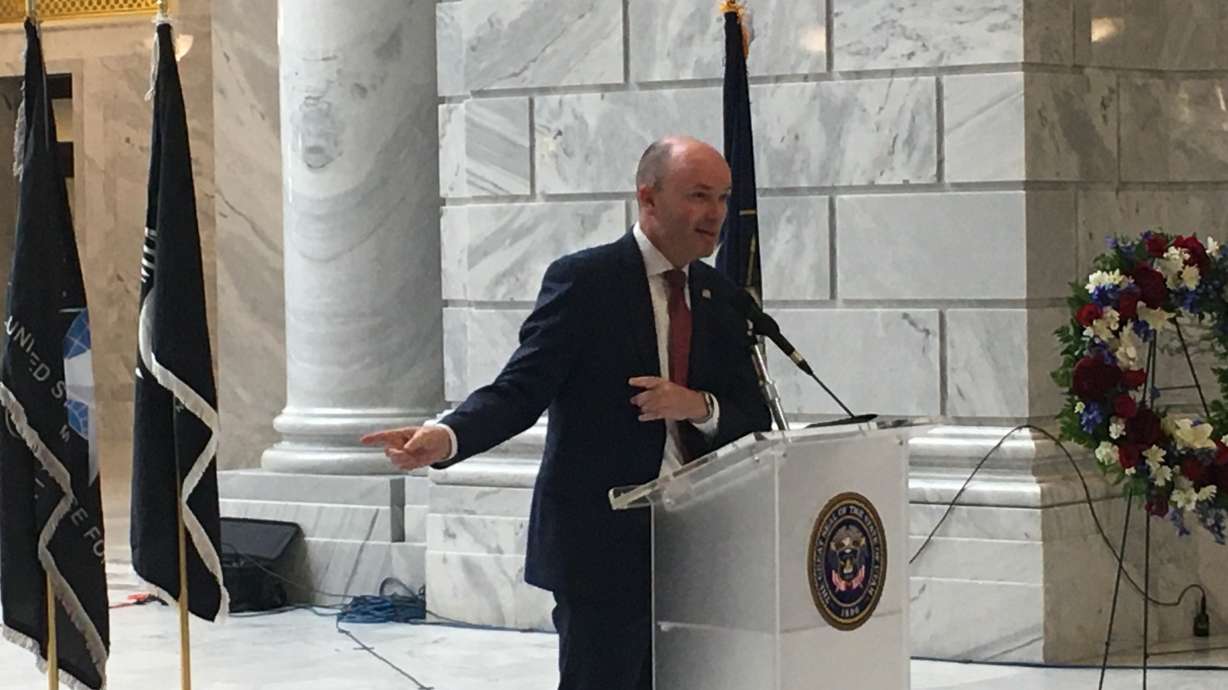 Utah Gov. Spencer Cox speaks during a Memorial Day event held on Monday at the Utah State Capitol in Salt Lake City. Following the event, he and U.S. Sen. Mitt Romney spoke with reporters about ways lawmakers can curb gun violence in the wake of the Uvalde, Texas, school shooting.