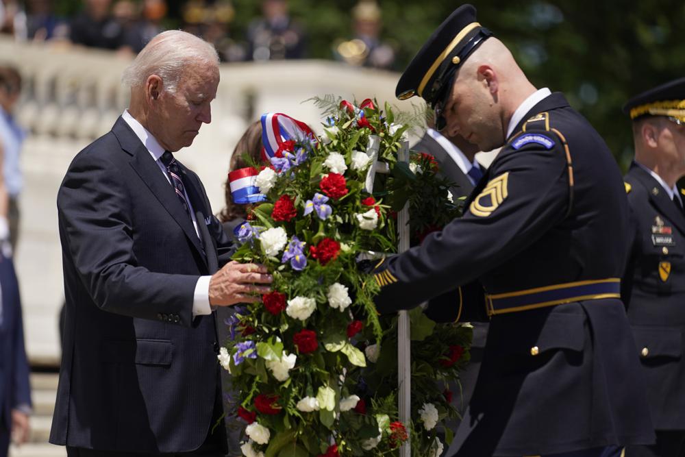President Joe Biden lays a wreath at The Tomb of the Unknown Soldier at Arlington National Cemetery on Monday, Memorial Day, in Arlington, Va. President Joe Biden says there may some bipartisan support to tighten restrictions on the kind of high-powered weapons used by the gunman in the Texas school shooting. 