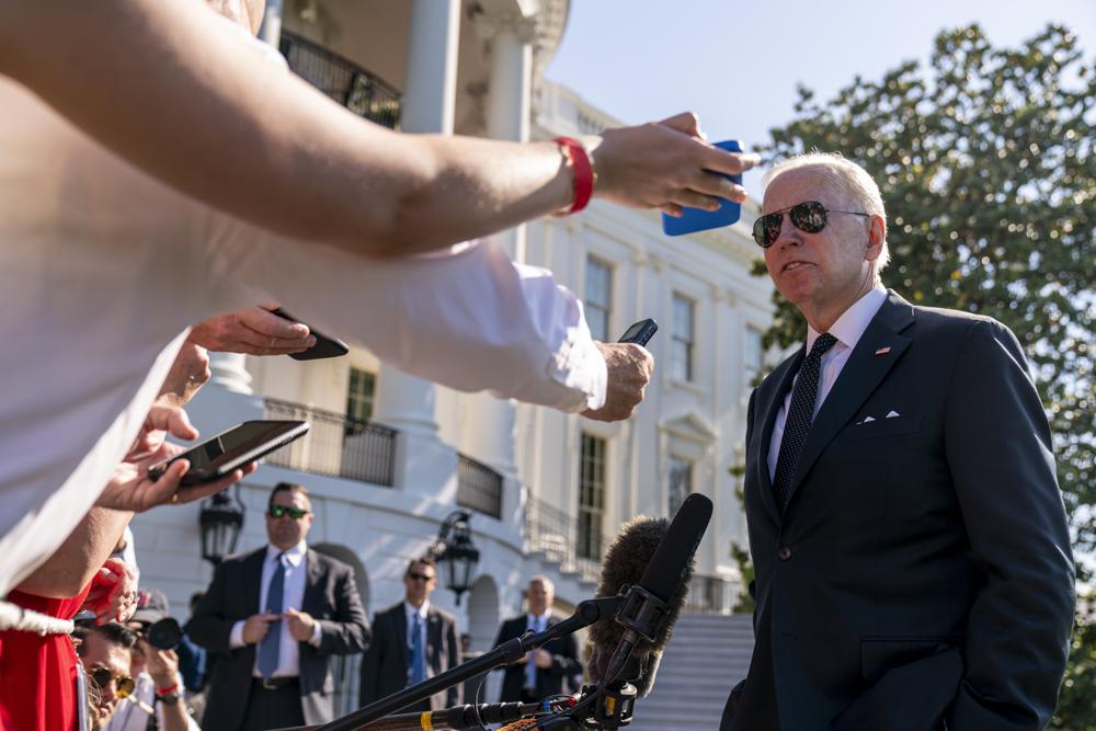 President Joe Biden speaks to members of the media on the South Lawn of the White House in Washington, Monday, after returning from Wilmington, Del. Biden says there may some bipartisan support to tighten restrictions on the kind of high-powered weapons used by the gunman in the Texas school shooting.