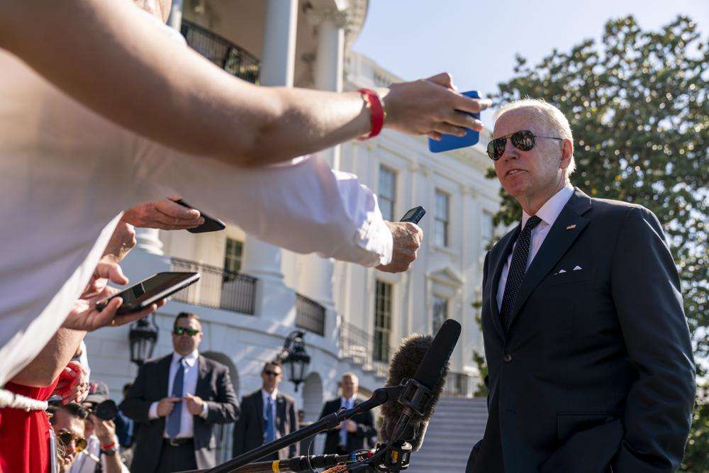 President Joe Biden speaks to members of the media on the South Lawn of the White House in Washington, Monday, after returning from Wilmington, Del. Biden says there may some bipartisan support to tighten restrictions on the kind of high-powered weapons used by the gunman in the Texas school shooting.