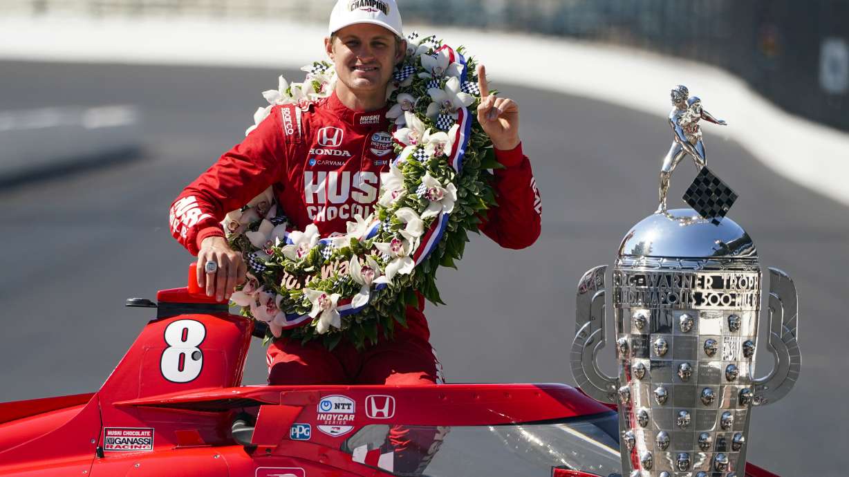 Marcus Ericsson, of Sweden, poses with the Borg-Warner Trophy during the traditional winners photo session at Indianapolis Motor Speedway in Indianapolis, Monday, May 30, 2022. Ericsson won the 106th running of the Indianapolis 500 auto race Sunday.