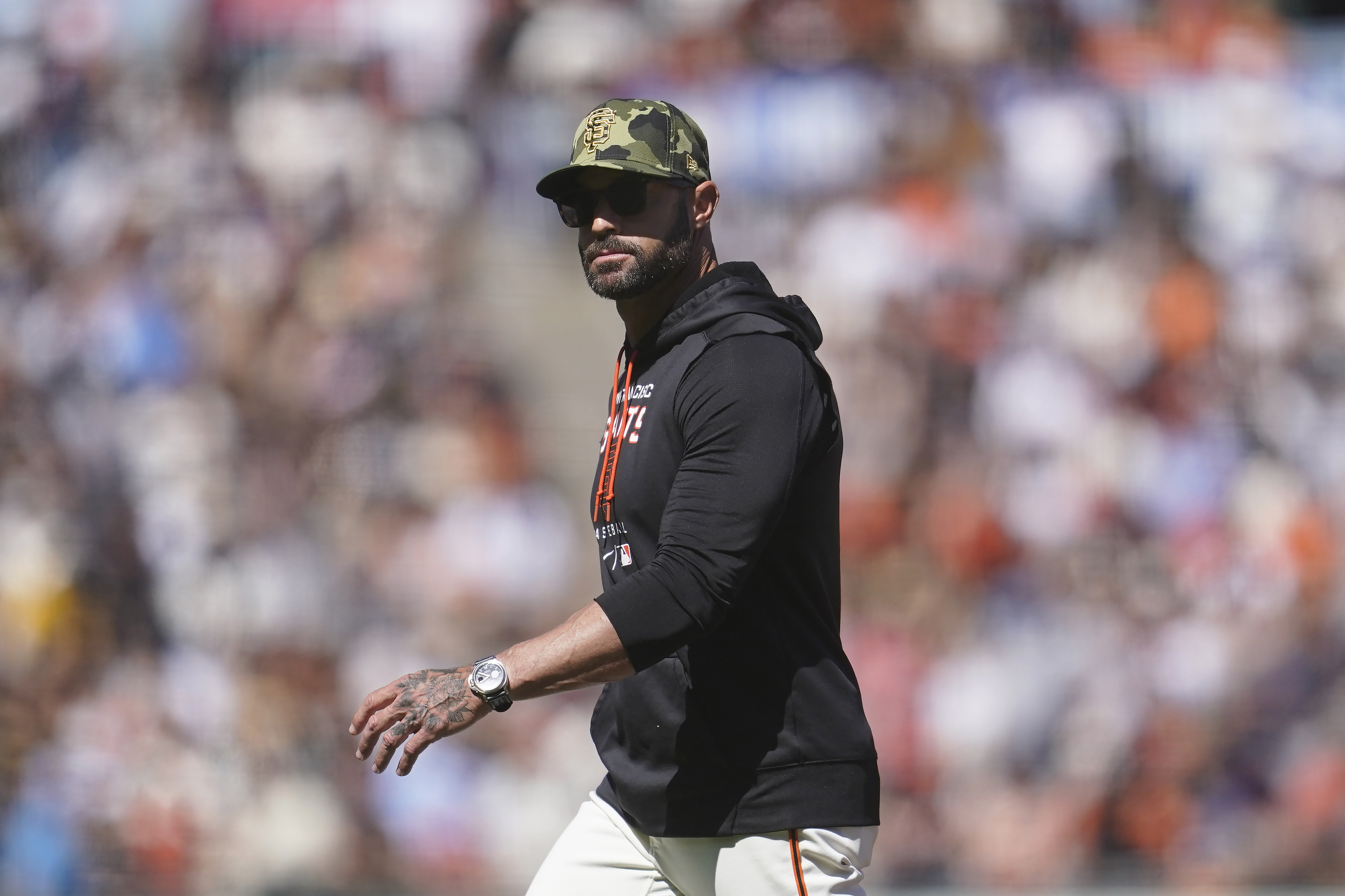 San Francisco Giants manager Gabe Kapler walks to the dugout after making a pitching change during the ninth inning of a baseball game against the San Diego Padres in San Francisco, Saturday, May 21, 2022. 