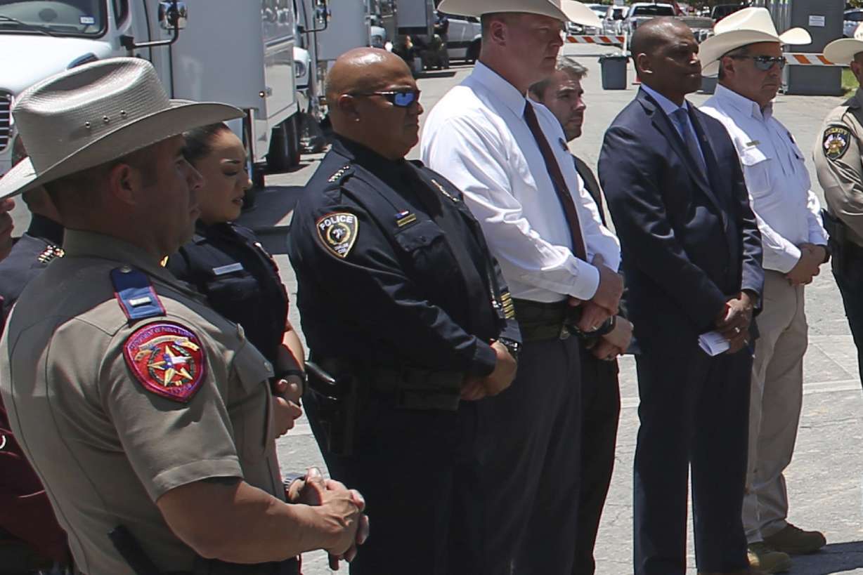 Uvalde School Police Chief Pete Arredondo, third from left, stands during a news conference outside of the Robb Elementary school in Uvalde, Texas, Thursday.