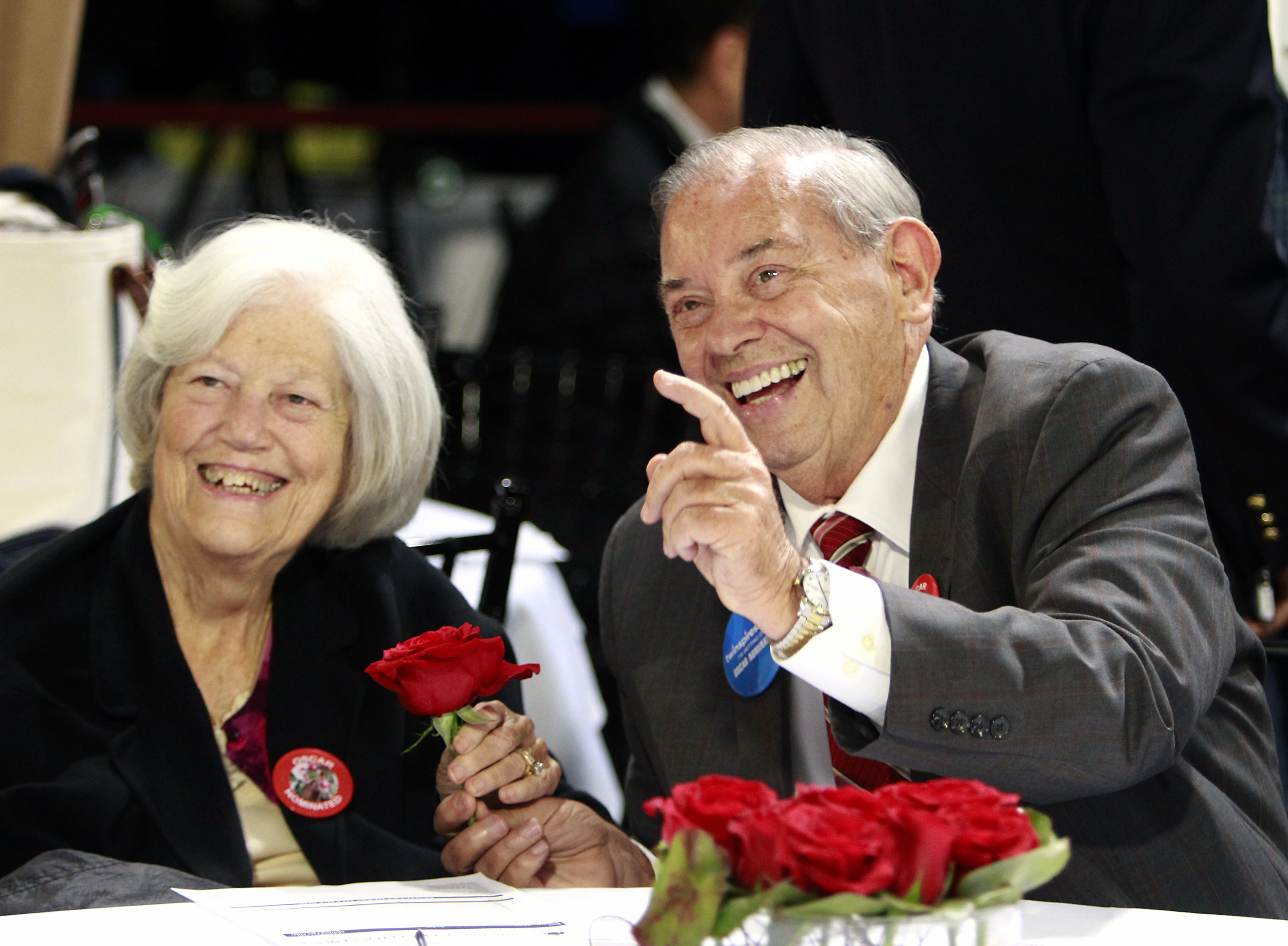 FILE - Owners of Kentucky Derby entrant Oscar Nominated, Ken, right, and Sarah Ramsey, trade roses before the post position draw for the 142nd Kentucky Derby at Churchill Downs in Louisville, Ky., May 4, 2016. Sarah, a leading thoroughbred breeder and owner, has died. According to a Facebook post on the family farm's account, she died Sunday, May 30, 2022, at her home in Nicholasville, Ky. 