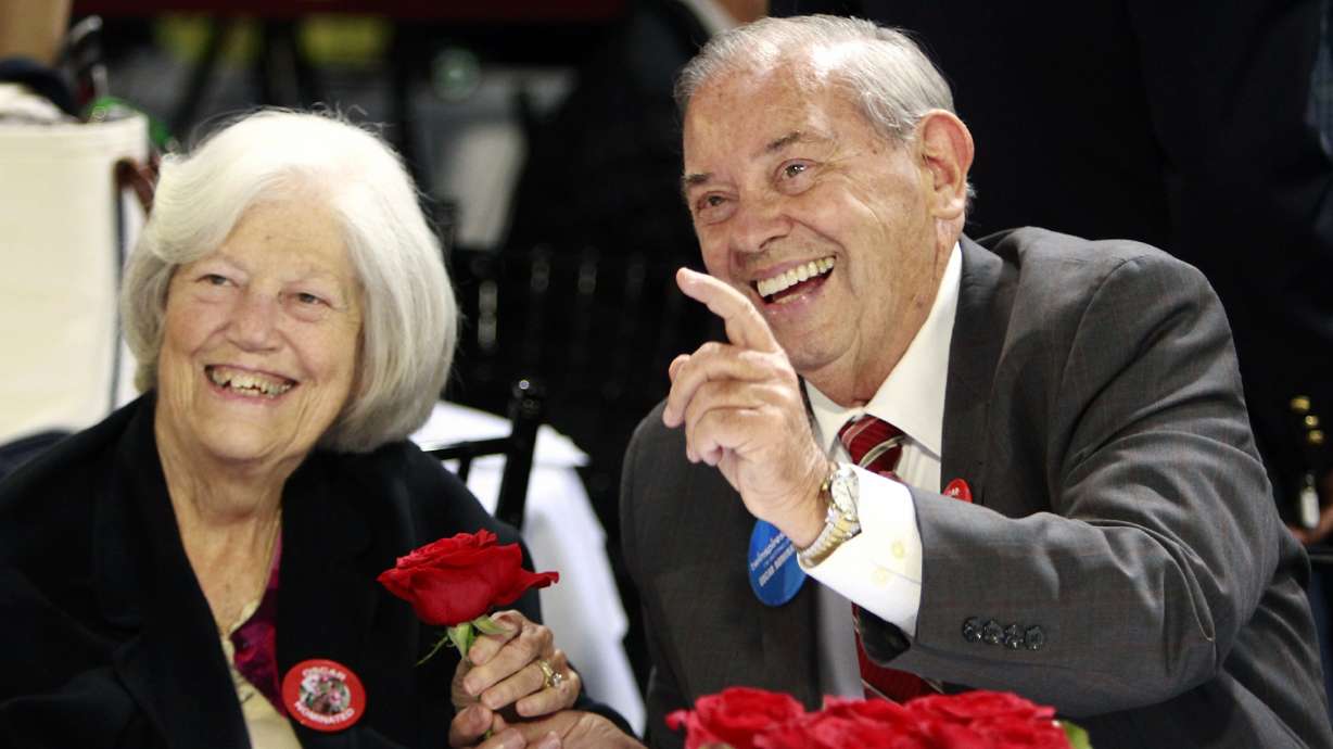 FILE - Owners of Kentucky Derby entrant Oscar Nominated, Ken, right, and Sarah Ramsey, trade roses before the post position draw for the 142nd Kentucky Derby at Churchill Downs in Louisville, Ky., May 4, 2016. Sarah, a leading thoroughbred breeder and owner, has died. According to a Facebook post on the family farm's account, she died Sunday, May 30, 2022, at her home in Nicholasville, Ky.