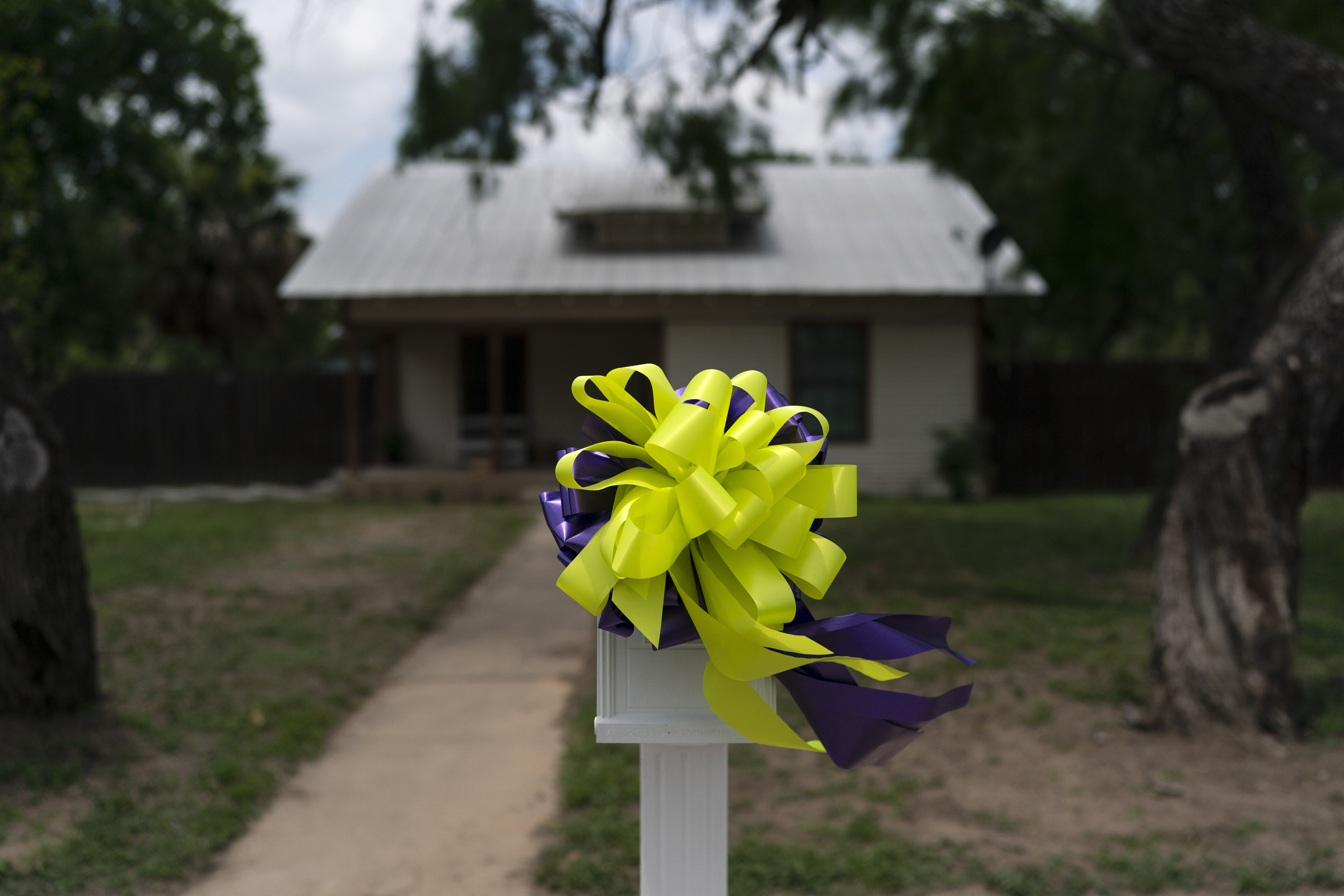 Bows adorn a mailbox outside the home of Maite Yuleana Rodriguez, one of the victims killed in last week's elementary school shooting in Uvalde, Texas, Monday.