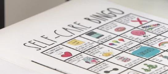Hailey Barrett, a senior graduate of Syracuse High School, assembles crisis kits for the school's counseling center to hand out to students Monday.