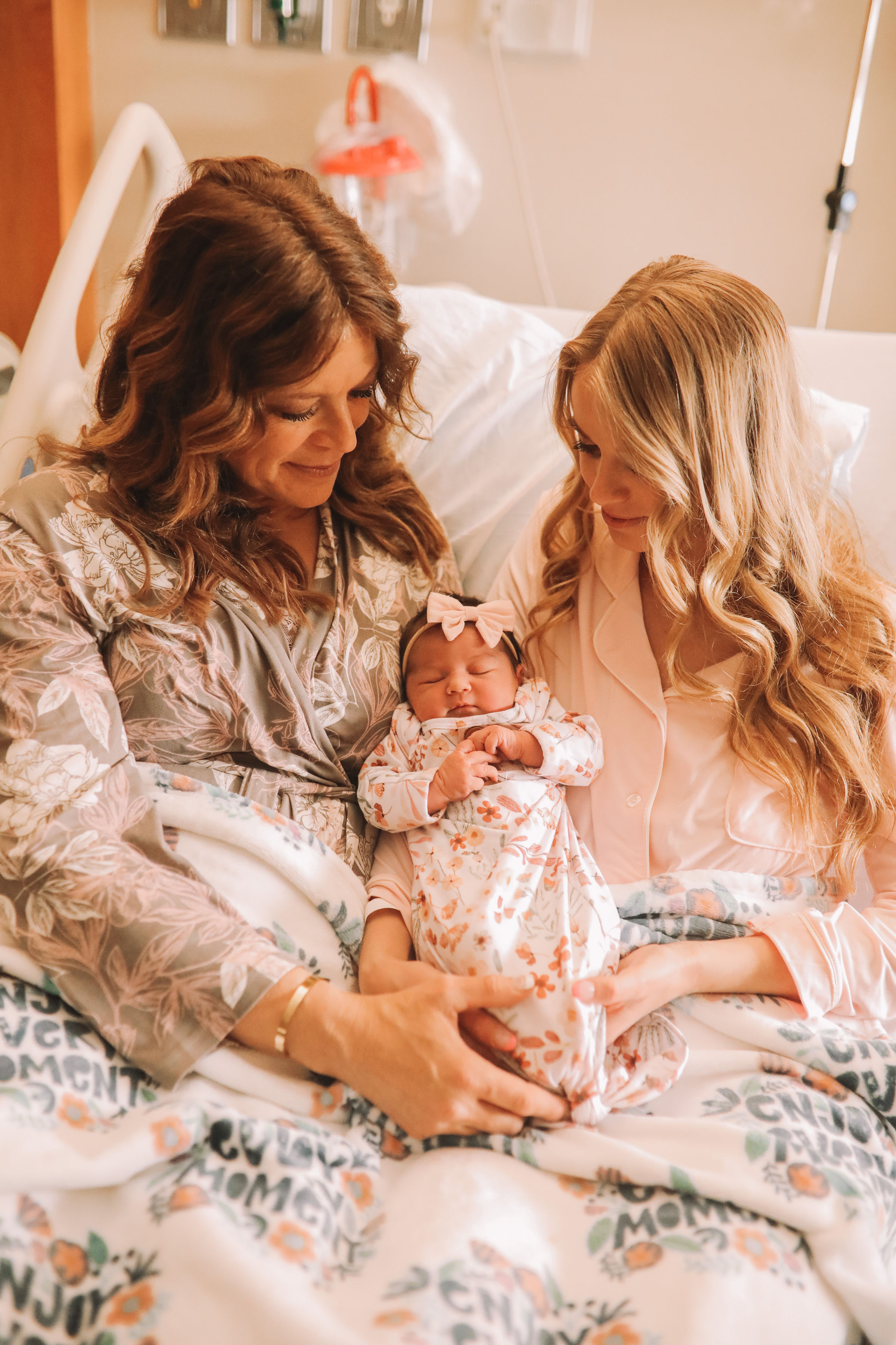 Chalise Smith, 50, poses with her daughter Kaitlyn Munoz after giving birth to her granddaughter as a surrogate.