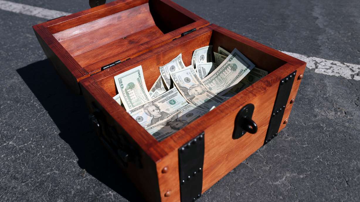 A treasure chest filled with $20,000 is pictured during a press conference in the Best Buy parking lot in South Salt Lake on May 31, as John Maxim and David Cline announce plans to hide the money in the Utah wilderness. The chest was located on the Ben Lomond Trail.