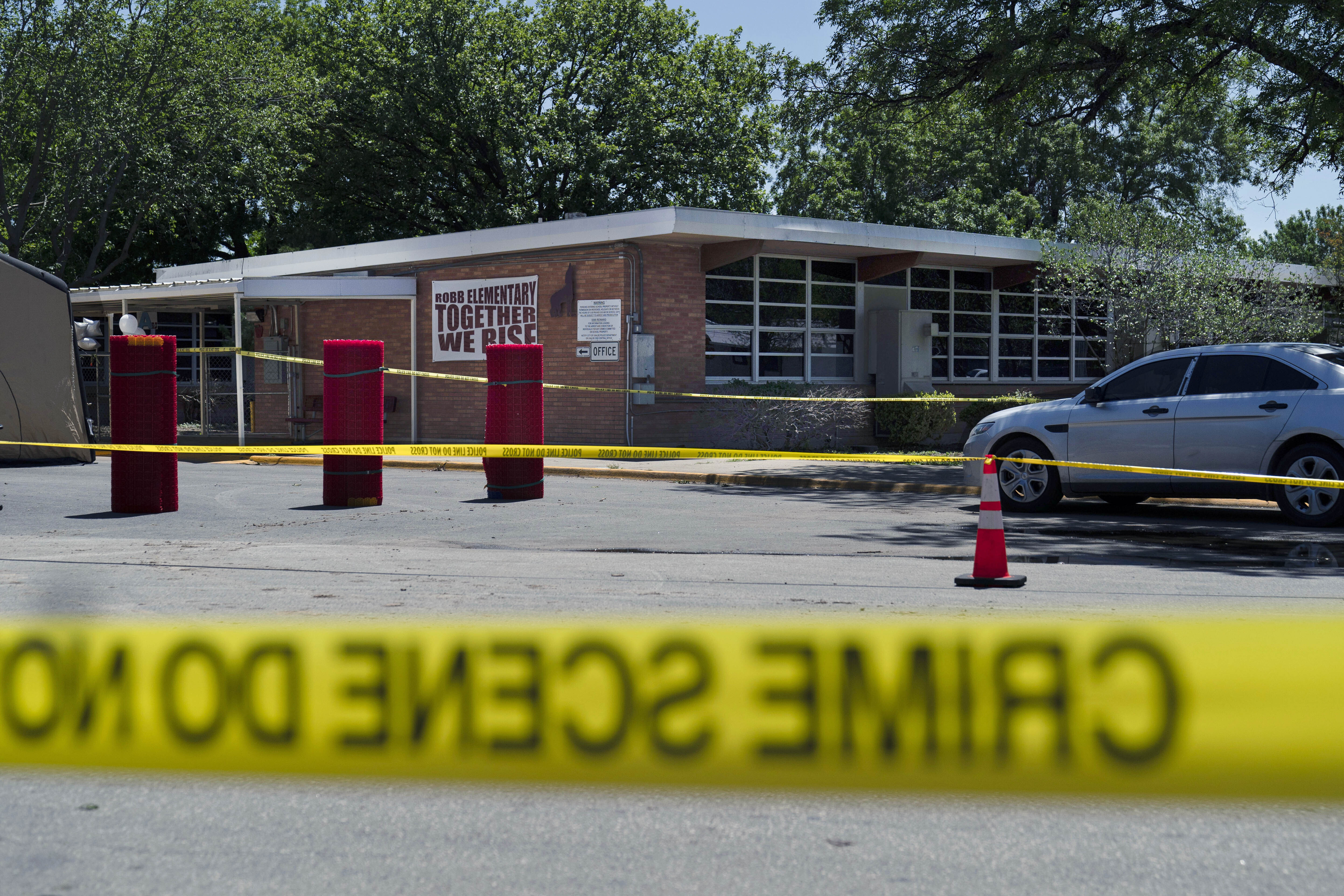 Crime scene tape surrounds Robb Elementary School in Uvalde, Texas, May 25.
