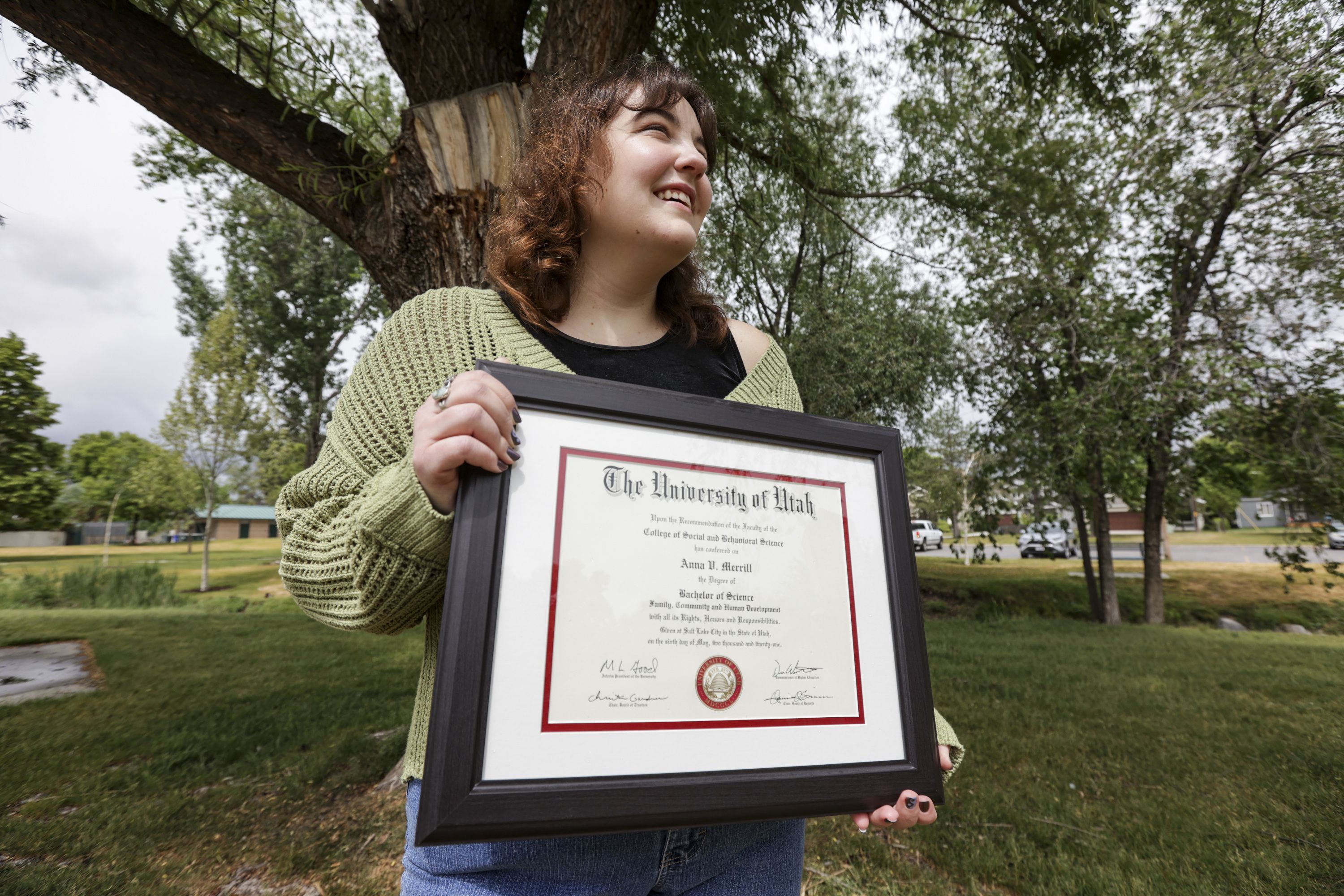 Anna Merrill, a recent college graduate, poses for a portrait at Fitts Park in Salt Lake City on Monday.