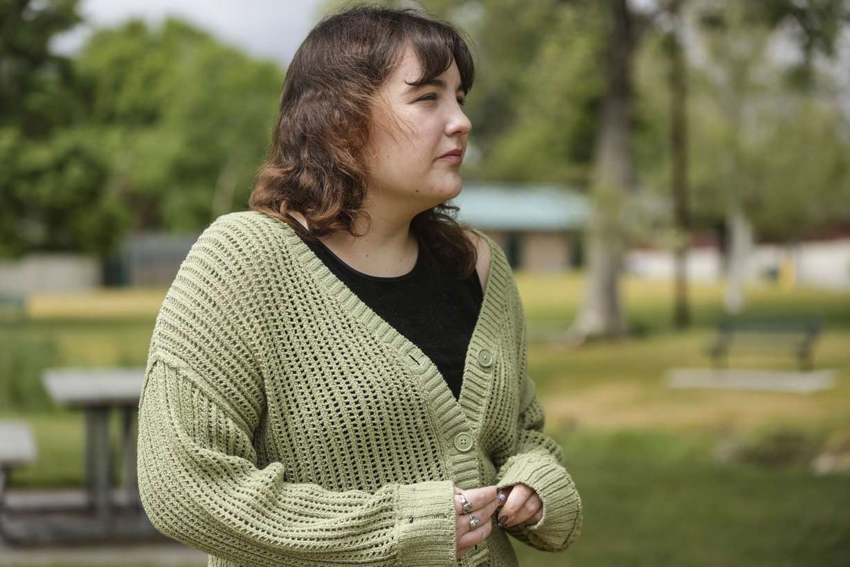 Anna Merrill, a recent college graduate poses for a portrait at Fitts Park in Salt Lake City on Monday, May 30, 2022.