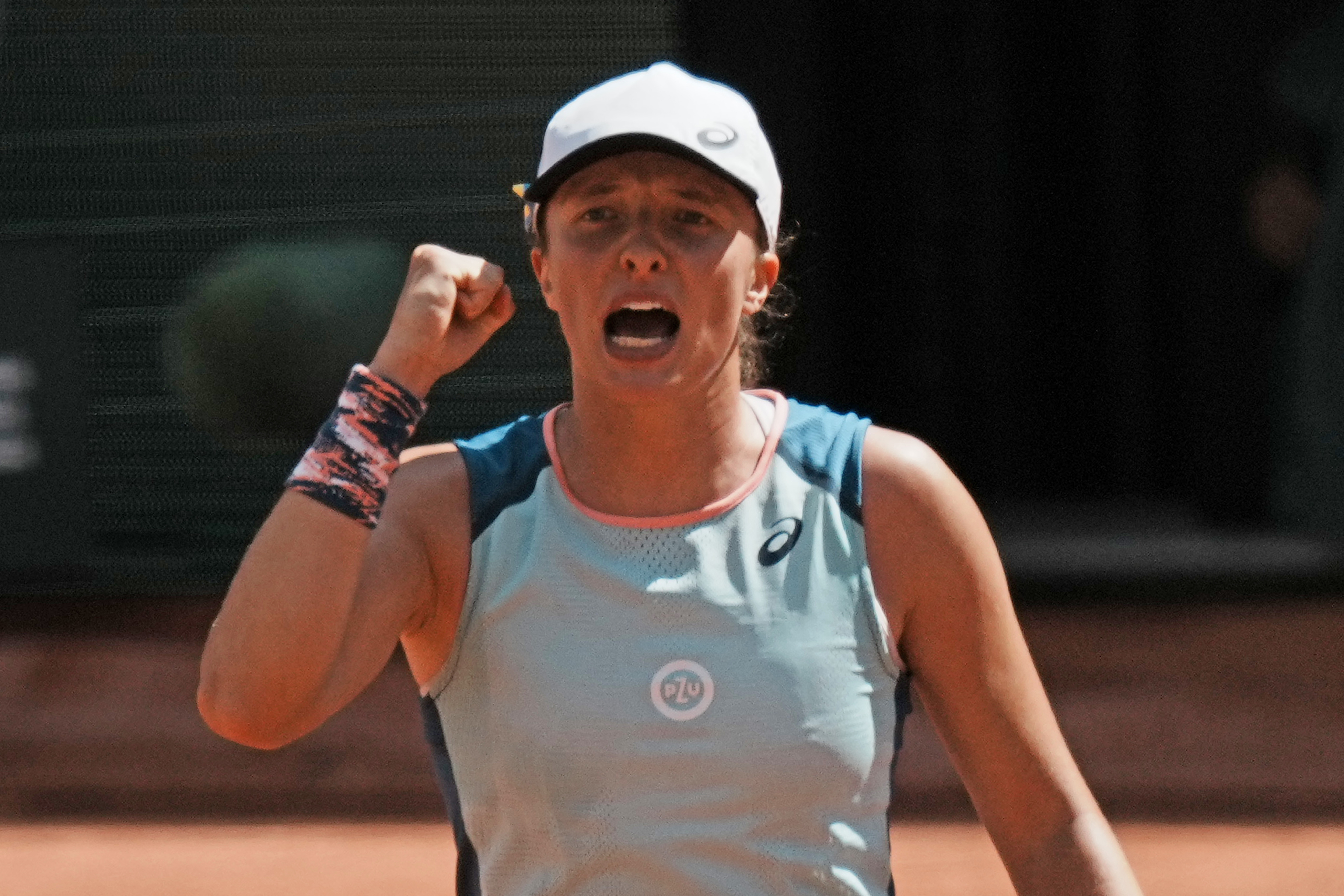Poland's Iga Swiatek clenches her fist after defeating Jessica Pegula of the U.S. during their quarterfinal match of the French Open tennis tournament at the Roland Garros stadium Wednesday, June 1, 2022 in Paris. Swiatek won 6-3, 6-2. 