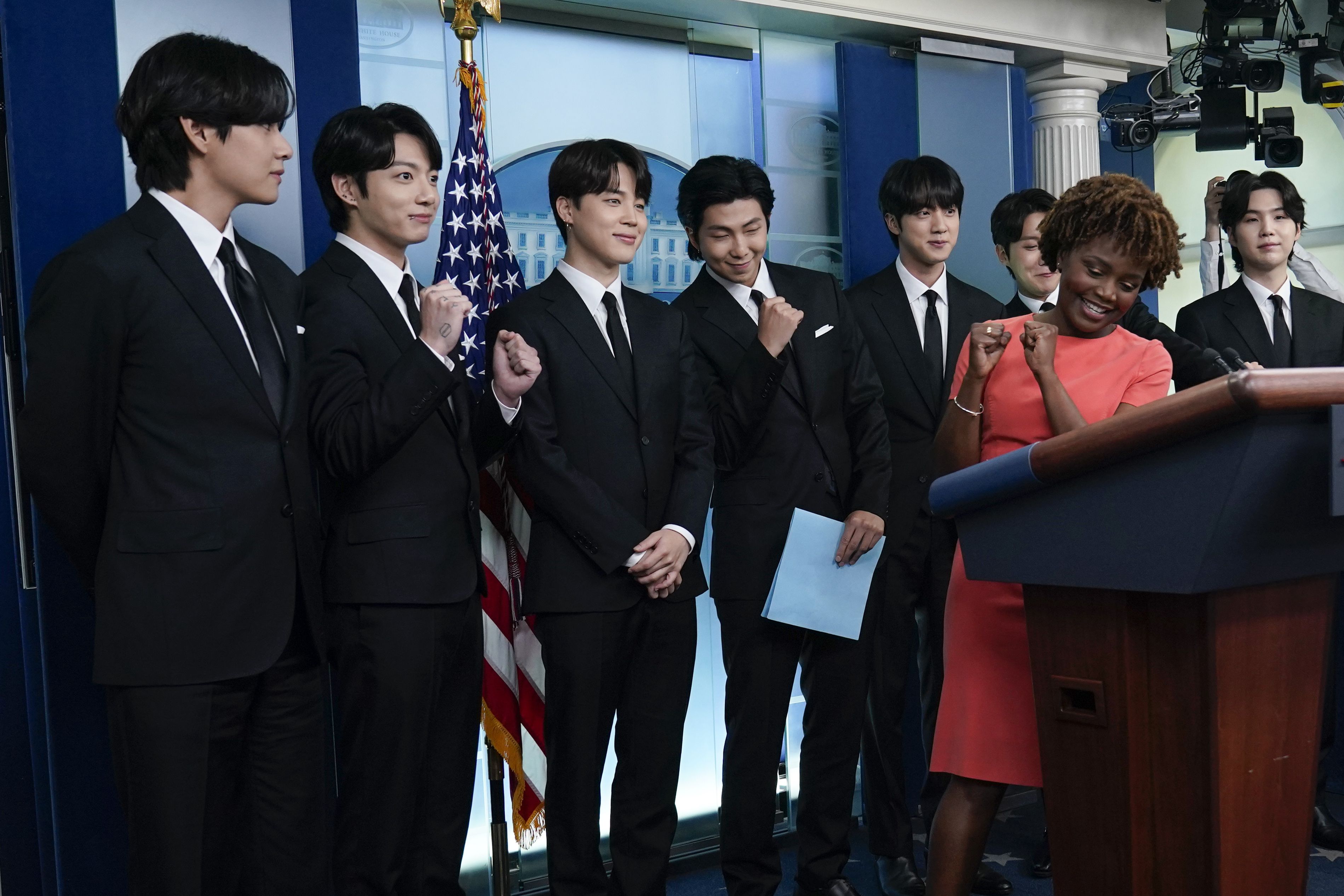 Members of the K-pop supergroup BTS, from left, V, Jungkook, Jimin, RM, Jin, J-Hope, Suga, join White House press secretary Karine Jean-Pierre during the daily briefing at the White House in Washington, Tuesday.
