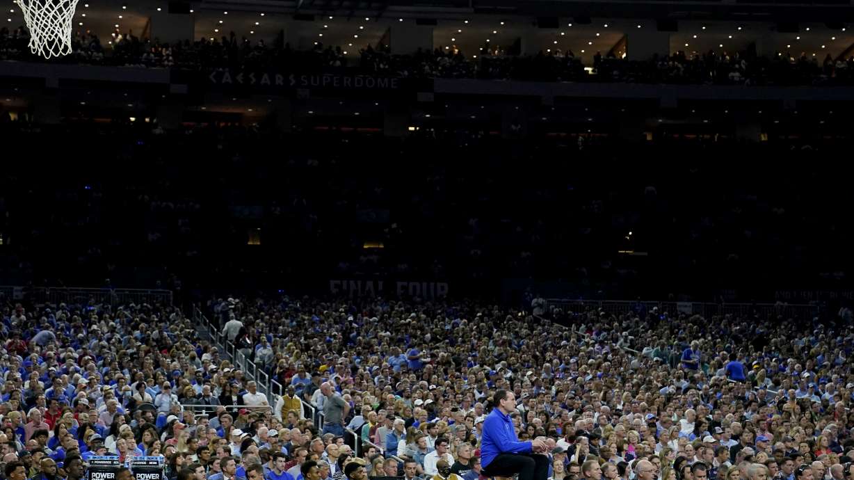 FILE - Duke head coach Mike Krzyzewski watches his team play against North Carolina during a college basketball game in the semifinal round of the Men's Final Four NCAA tournament, Saturday, April 2, 2022, in New Orleans. The 75-year-old has spent time with family, travel and a new puppy in the two months since his coaching retirement.