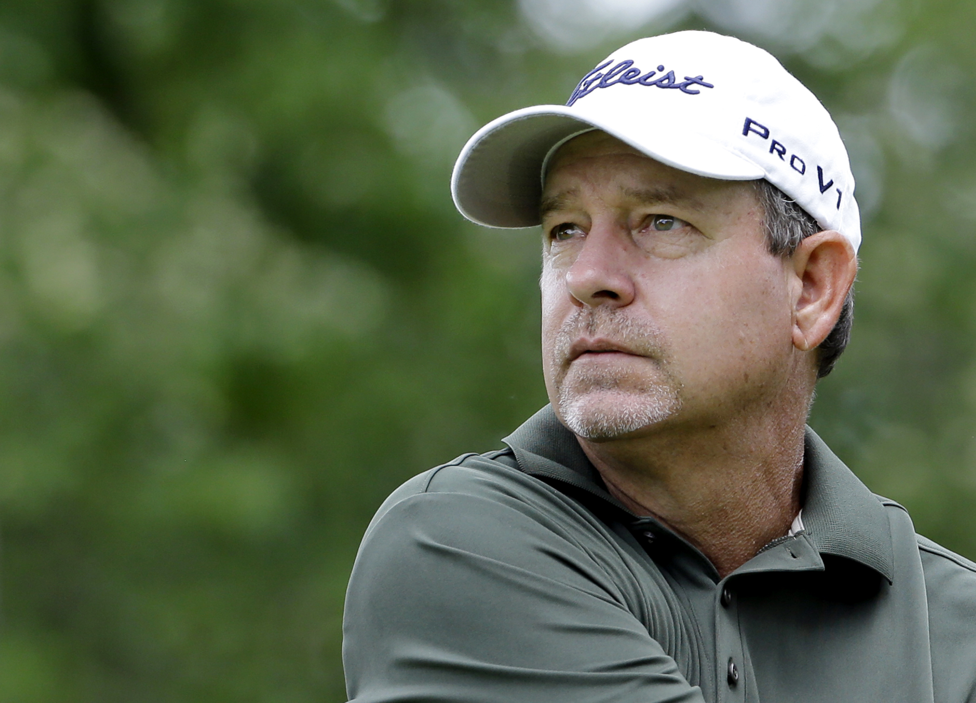 FILE - Bart Bryant watches his tee shot on the ninth hole during the second round of the Encompass Championship golf tournament in Glenview, Ill., June 21, 2014. Professional golfer Bryant was killed and his wife was injured when a truck slammed into their SUV while they were stopped in a line of vehicles on a central Florida roadway for a construction crew, authorities said Wednesday, June 1, 2022. 
