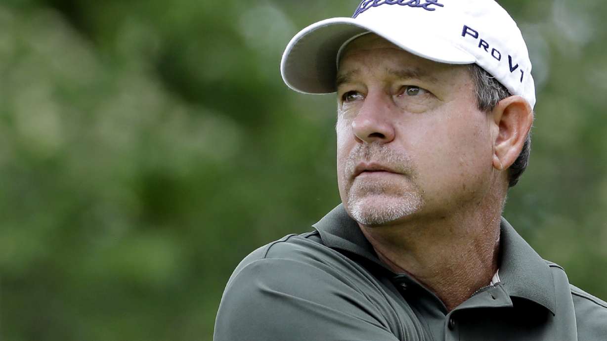 FILE - Bart Bryant watches his tee shot on the ninth hole during the second round of the Encompass Championship golf tournament in Glenview, Ill., June 21, 2014. Professional golfer Bryant was killed and his wife was injured when a truck slammed into their SUV while they were stopped in a line of vehicles on a central Florida roadway for a construction crew, authorities said Wednesday, June 1, 2022.