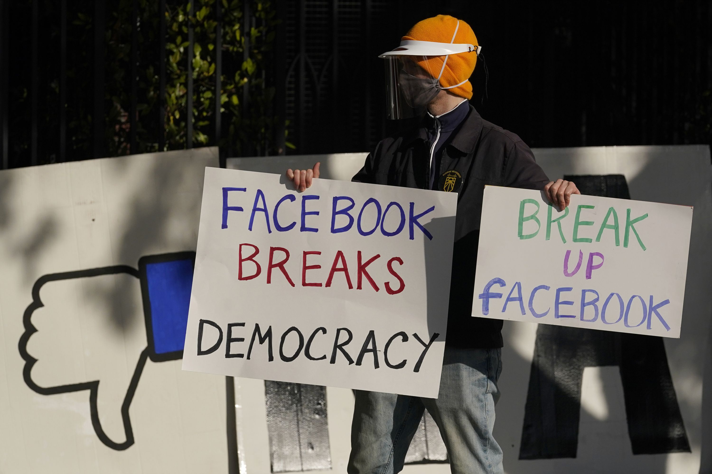 A demonstrator joins others outside of the home of Facebook CEO Mark Zuckerberg to protest what they say is Facebook spreading disinformation in San Francisco on Nov. 21, 2020. The Supreme Court issued an order on Tuesday temporarily blocking a Texas law that prohibits Big Tech platforms like Facebook, Twitter and YouTube from removing content based on the viewpoints they express.