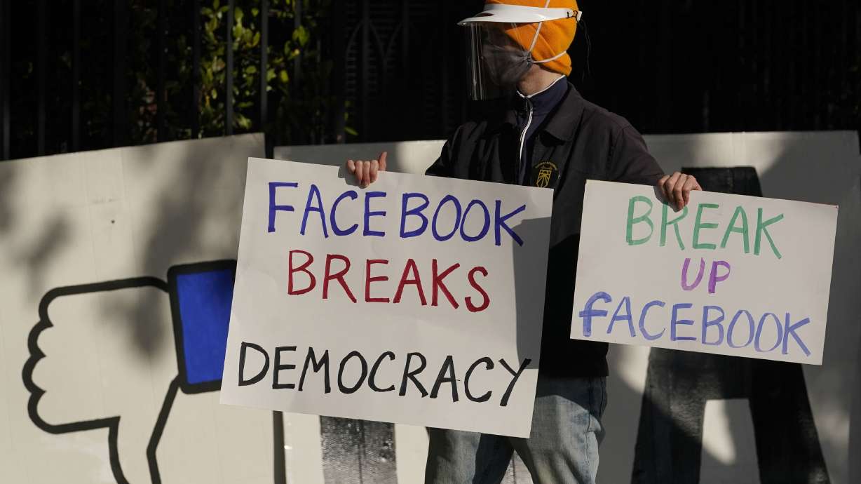 A demonstrator joins others outside of the home of Facebook CEO Mark Zuckerberg to protest what they say is Facebook spreading disinformation in San Francisco on Nov. 21, 2020. The Supreme Court issued an order on Tuesday temporarily blocking a Texas law that prohibits Big Tech platforms like Facebook, Twitter and YouTube from removing content based on the viewpoints they express.