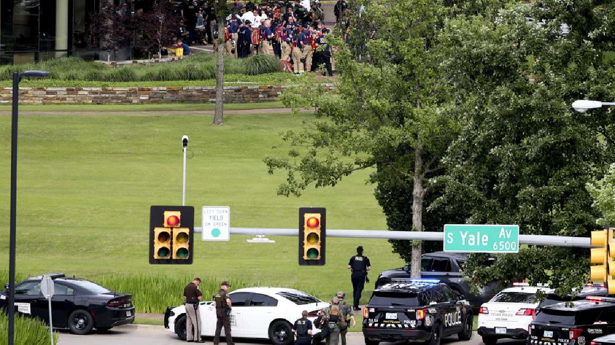 Tulsa police and firefighters respond to a shooting at the Natalie Medical Building Wednesday. in Tulsa, Okla. Multiple people were shot at a Tulsa medical building on a hospital campus Wednesday.