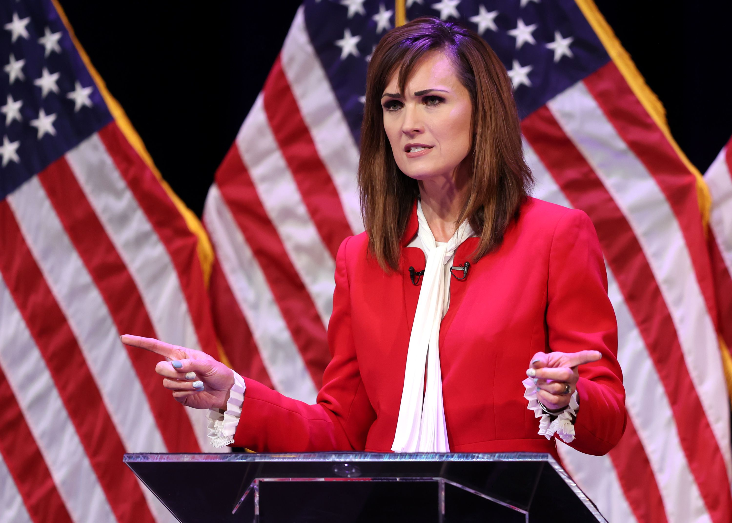 Ally Isom answers a question as she joins Becky Edwards and Sen. Mike Lee in a Utah GOP sponsored debate at Draper Park Middle School in Draper on Wednesday.