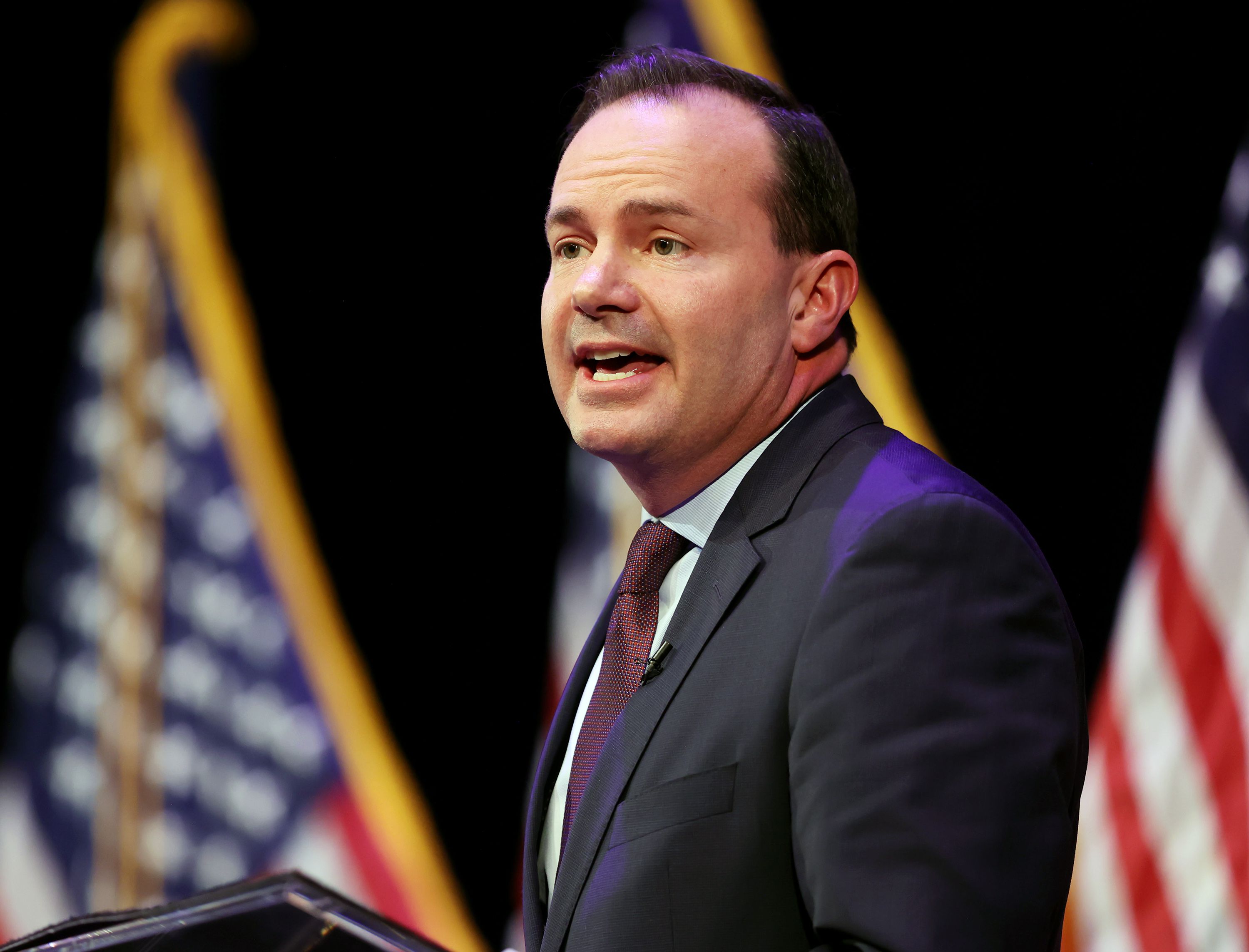 Sen. Mike Lee answers a question as he joins Becky Edwards and Ally Isom in a Utah GOP sponsored debate at Draper Park Middle School in Draper on Wednesday.