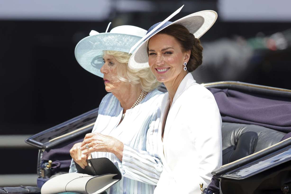 Camilla, Duchess of Cornwall, left, and Kate, Duchess of Cambridge ride in a carriage during the Trooping the Color, in London, Thursday on the first of four days of celebrations to mark the Platinum Jubilee.