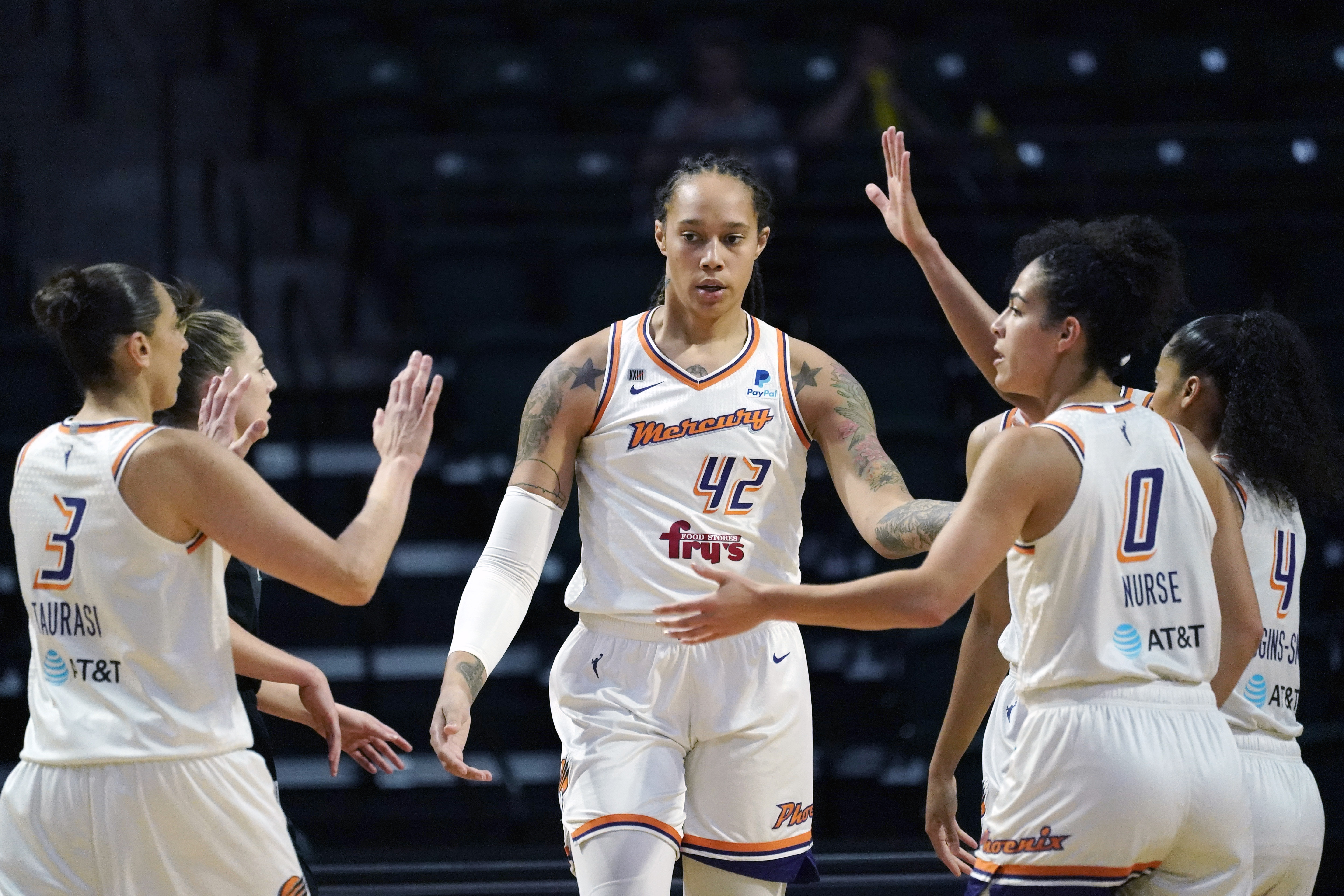 FILE - Phoenix Mercury's Brittney Griner (42) is congratulated on a play against the Seattle Storm in the first half of the second round of the WNBA basketball playoffs Sunday, Sept. 26, 2021, in Everett, Wash.  Brittney Griner has been able to receive emails and letters from WNBA players to an account Griner’s agent set up to allow them to communicate with her. The emails are printed out and delivered sporadically in bunches to Griner by her lawyers after being vetted by Russian officials. 