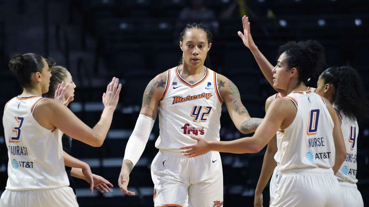 FILE - Phoenix Mercury's Brittney Griner (42) is congratulated on a play against the Seattle Storm in the first half of the second round of the WNBA basketball playoffs Sunday, Sept. 26, 2021, in Everett, Wash. Brittney Griner has been able to receive emails and letters from WNBA players to an account Griner’s agent set up to allow them to communicate with her. The emails are printed out and delivered sporadically in bunches to Griner by her lawyers after being vetted by Russian officials.