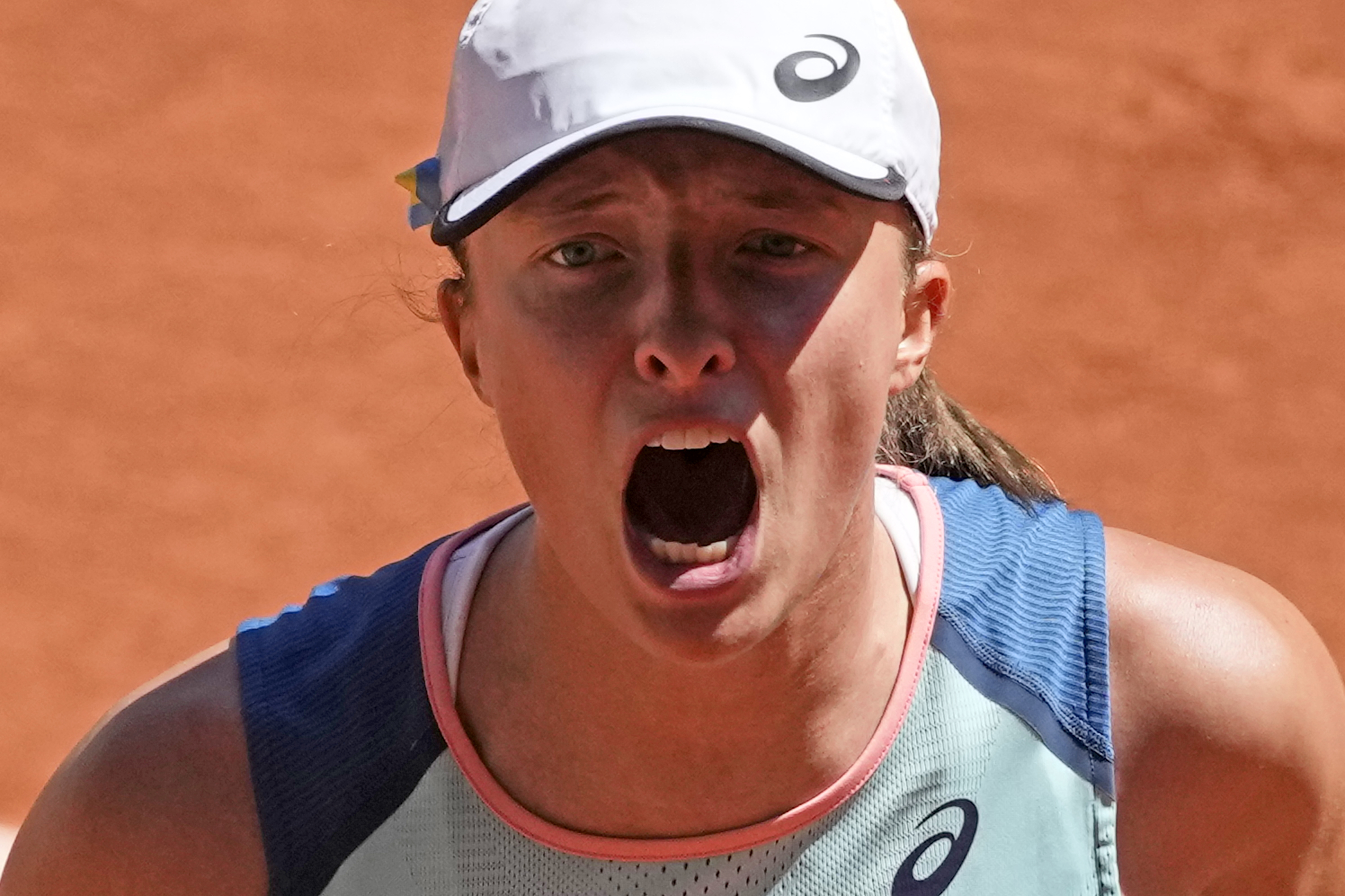 Poland's Iga Swiatek shouts as she defeats Russia's Daria Kasatkina during their semifinal match of the French Open tennis tournament at the Roland Garros stadium Thursday, June 2, 2022 in Paris. Swiatek won 6-2, 6-1.