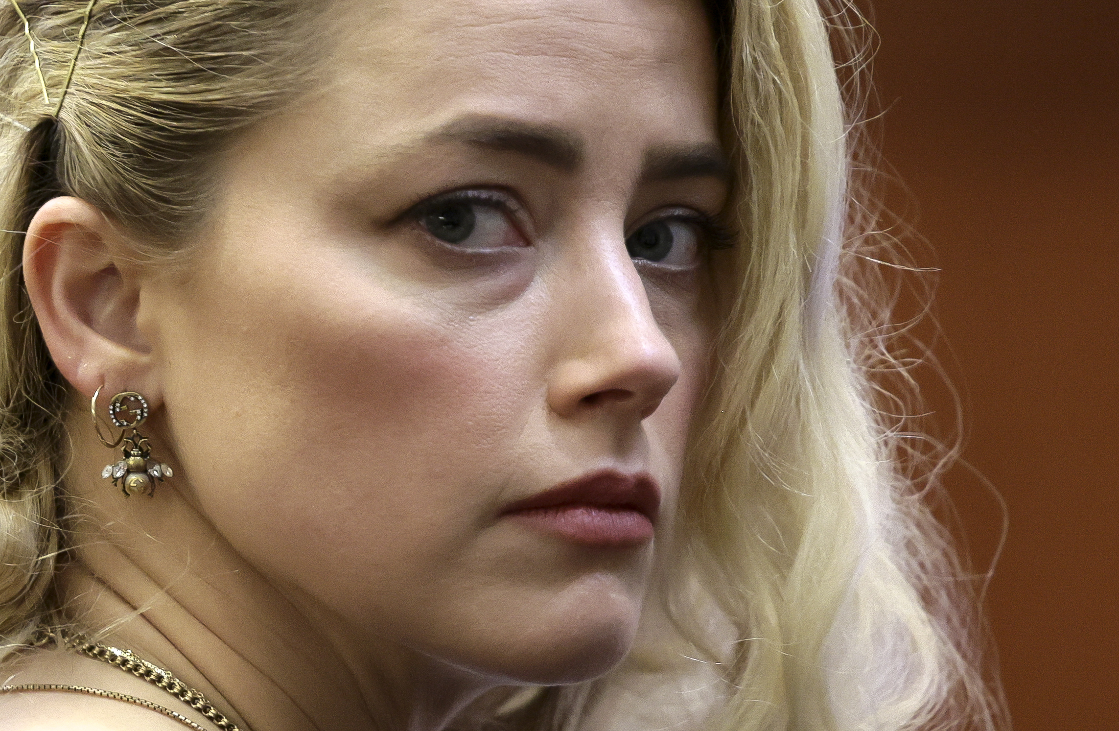 Actor Amber Heard waits before the verdict was read at the Fairfax County Circuit Courthouse in Fairfax, Va, Wednesday. The jury awarded Johnny Depp more than $10 million in his libel lawsuit against ex-wife Amber Heard. Heard's lawyer says she was "demonized" by ex-husband Depp's legal team and excoriated on social media. 