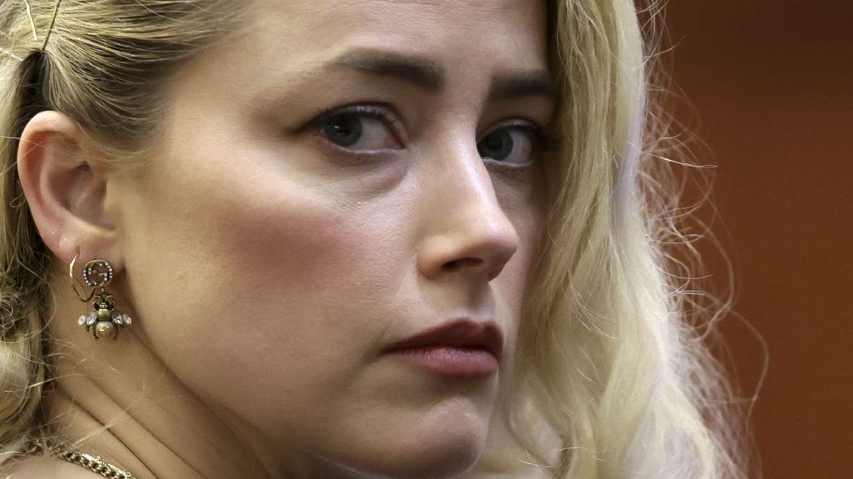 Actor Amber Heard waits before the verdict was read at the Fairfax County Circuit Courthouse in Fairfax, Va, Wednesday. The jury awarded Johnny Depp more than $10 million in his libel lawsuit against ex-wife Amber Heard. Heard's lawyer says she was "demonized" by ex-husband Depp's legal team and excoriated on social media.