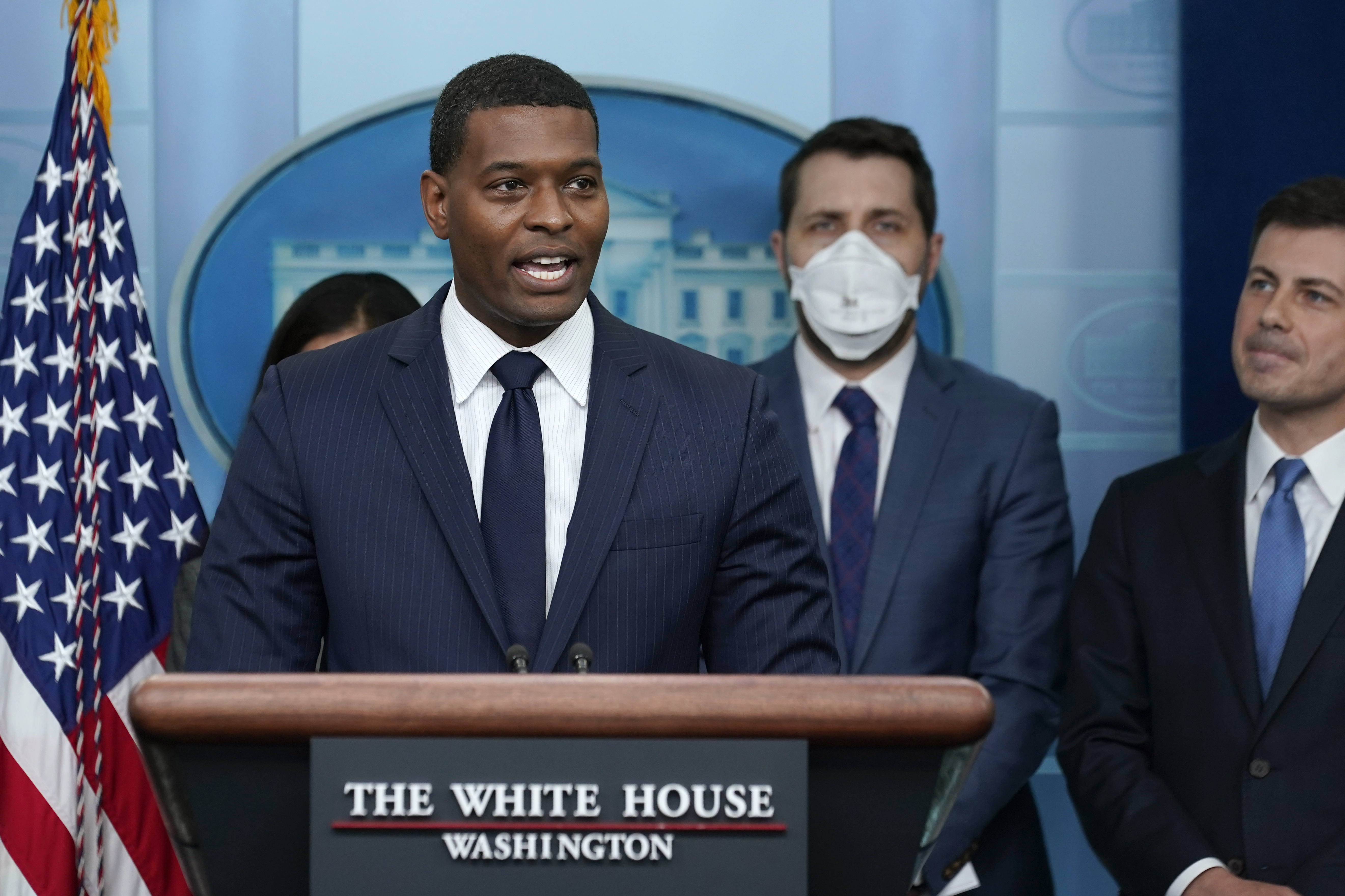 Environmental Protection Agency administrator Michael Regan, left, speaks during a briefing at the White House in Washington, May 16 on the six-month anniversary of the bipartisan infrastructure law. The EPA has proposed handing more power to states and tribes to block major energy projects based on water quality concerns. 
