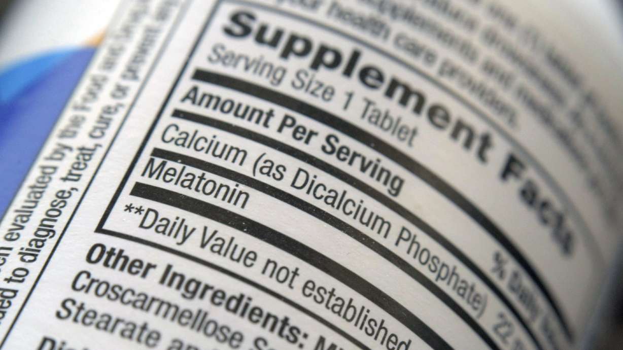 The label for a bottle of melatonin pills is seen in New York on Thursday. Melatonin is a hormone that helps control the body's sleep cycle.
