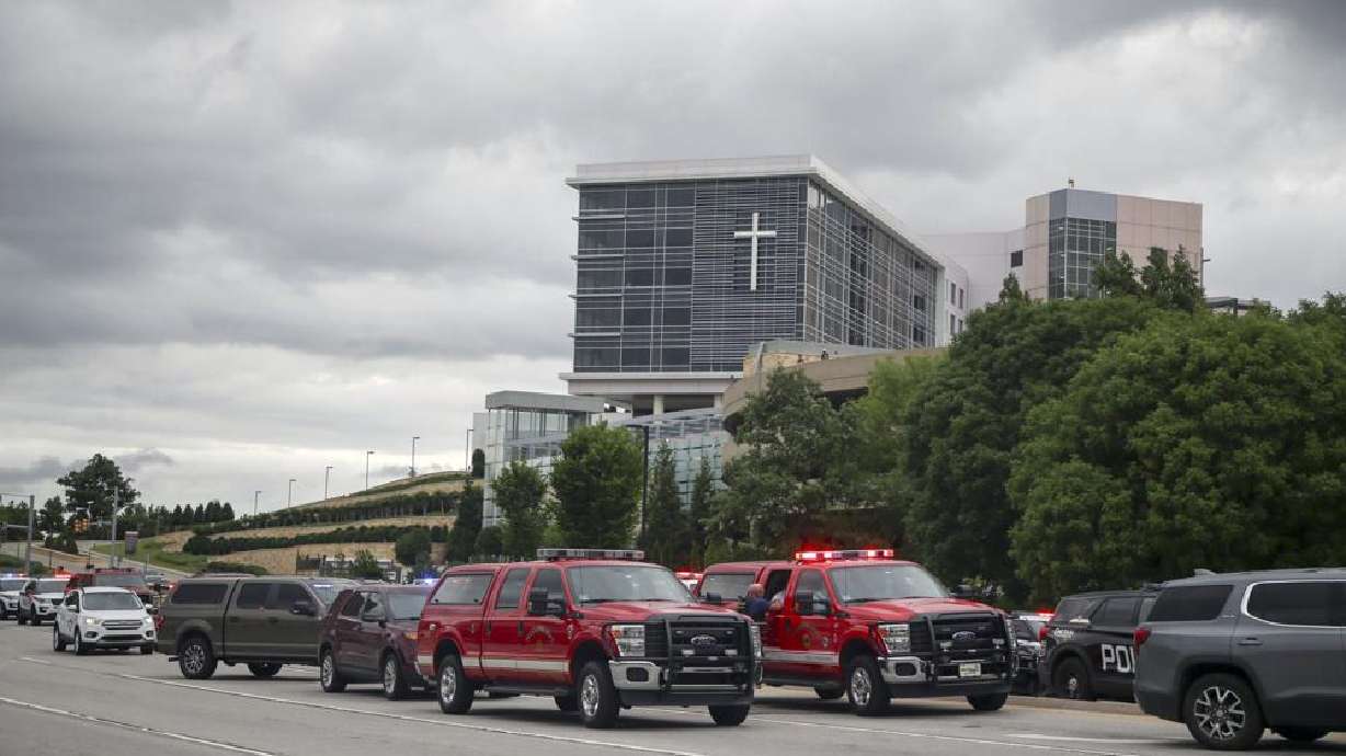 Tulsa police and firefighters respond to a shooting at the Natalie Medical Building Wednesday, in Tulsa, Okla. Multiple people were shot at a Tulsa medical building on a hospital campus Wednesday.