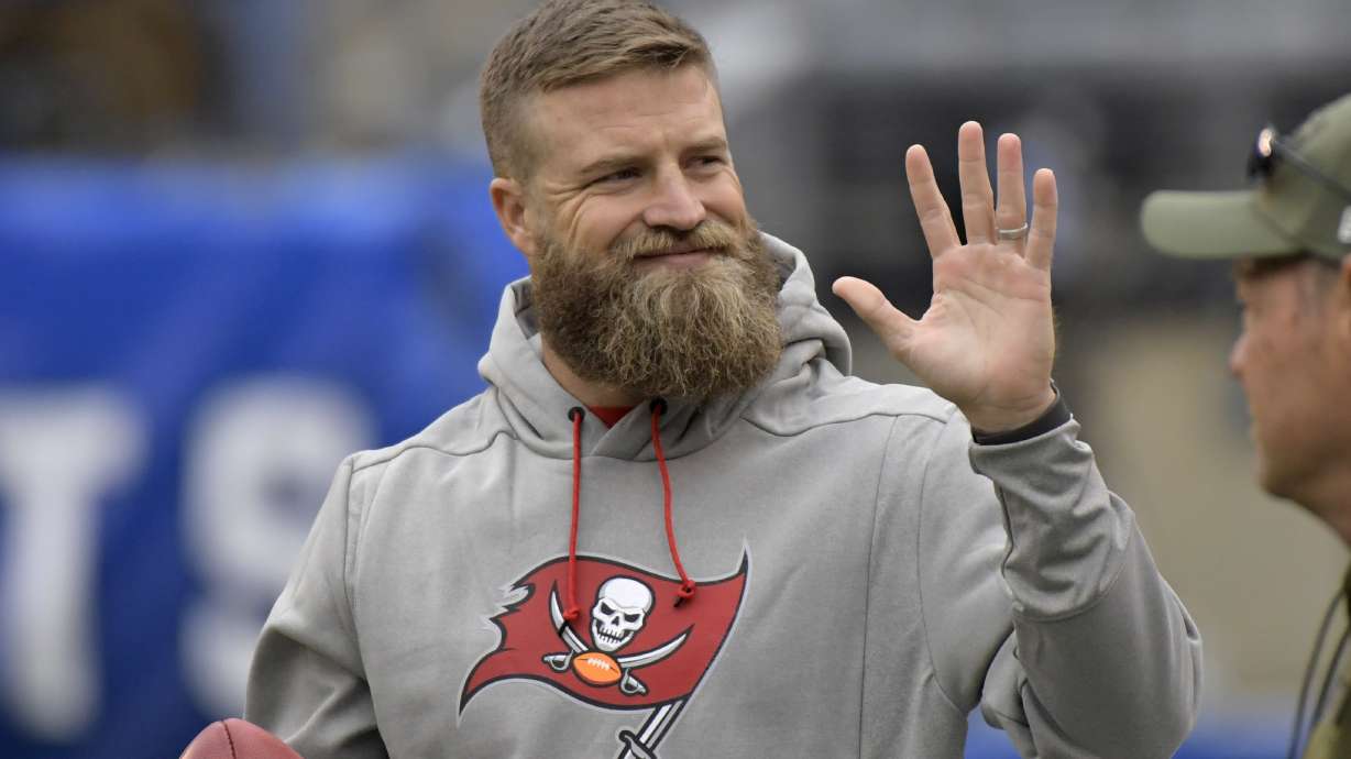 FILE - Tampa Bay Buccaneers quarterback Ryan Fitzpatrick waves to fans before an NFL football game against the New York Giants, Sunday, Nov. 18, 2018, in East Rutherford, N.J. Quarterback Ryan Fitzpatrick confirmed to The Associated Press on Friday, June 3, 2022, that he informed former teammates of his intention to retire a day earlier. Former Bills running back Fred Jackson first announced the news of Fitzpatrick’s retirement on his Twitter account by posting an image and message from his former Buffalo teammate.