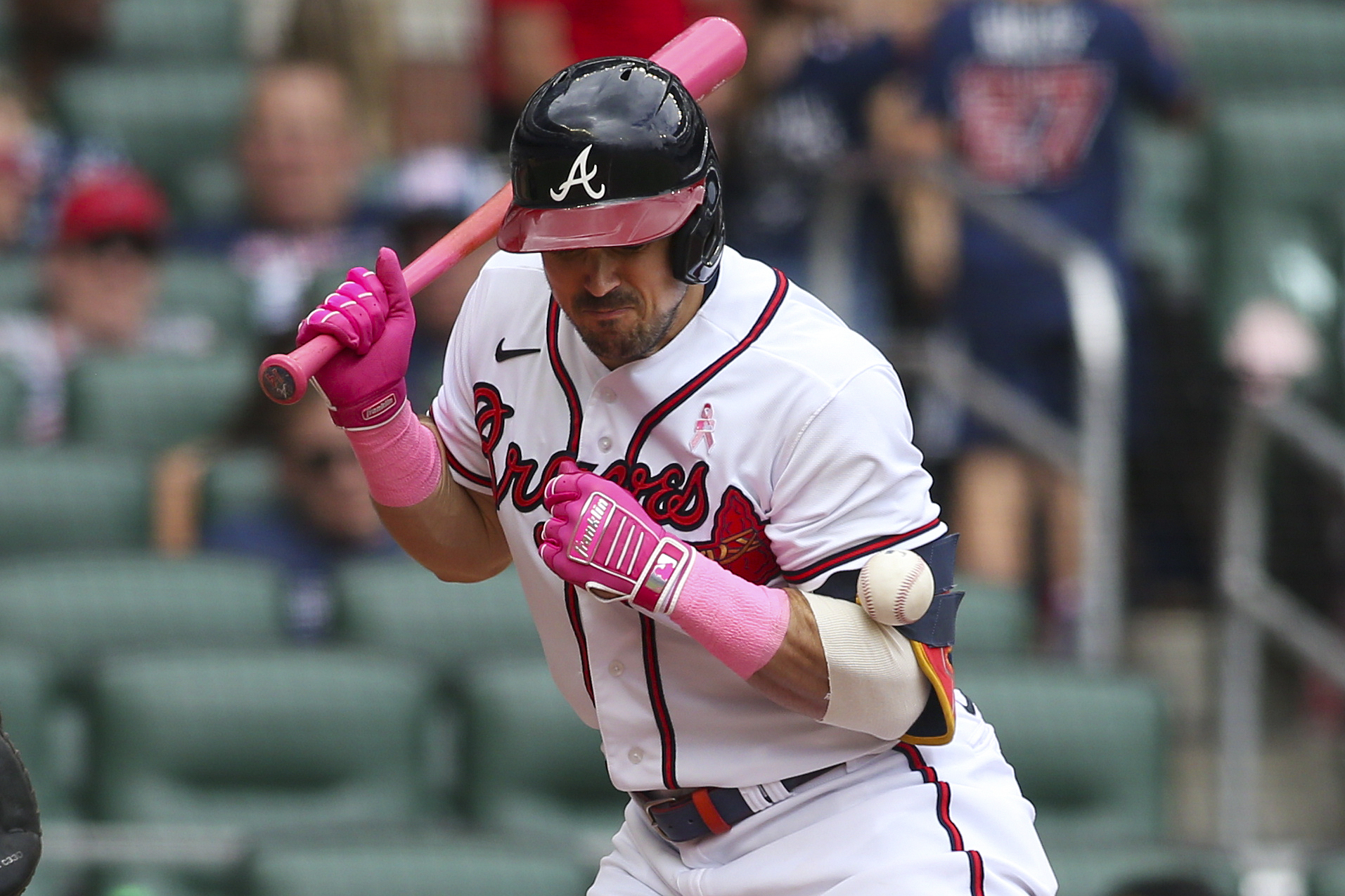 Atlanta Braves center fielder Adam Duvall (14) is hit by a pitch in the fifth inning of a baseball game against the Milwaukee Brewers, Sunday, May 8, 2022, in Atlanta. 