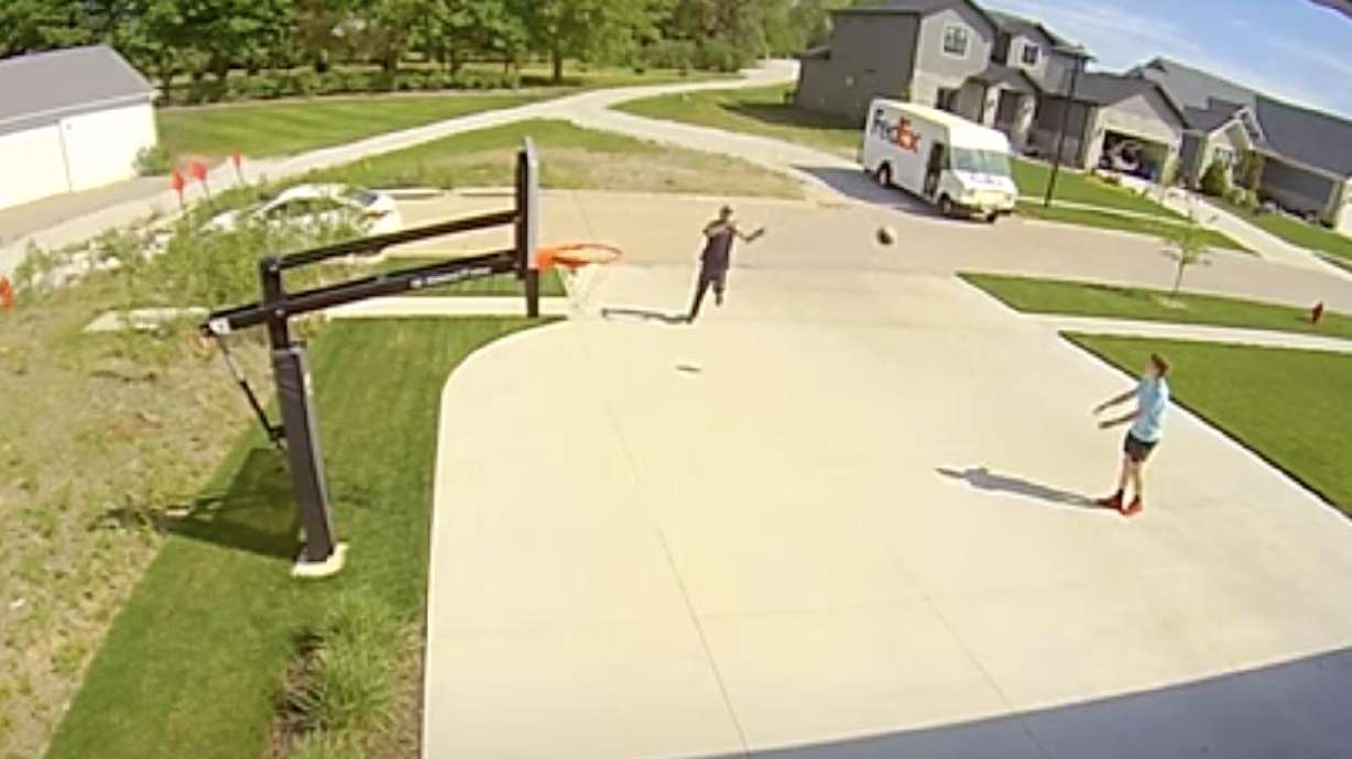A FedEx driver gets the urge to dunk a basketball in this video posted on May 26.