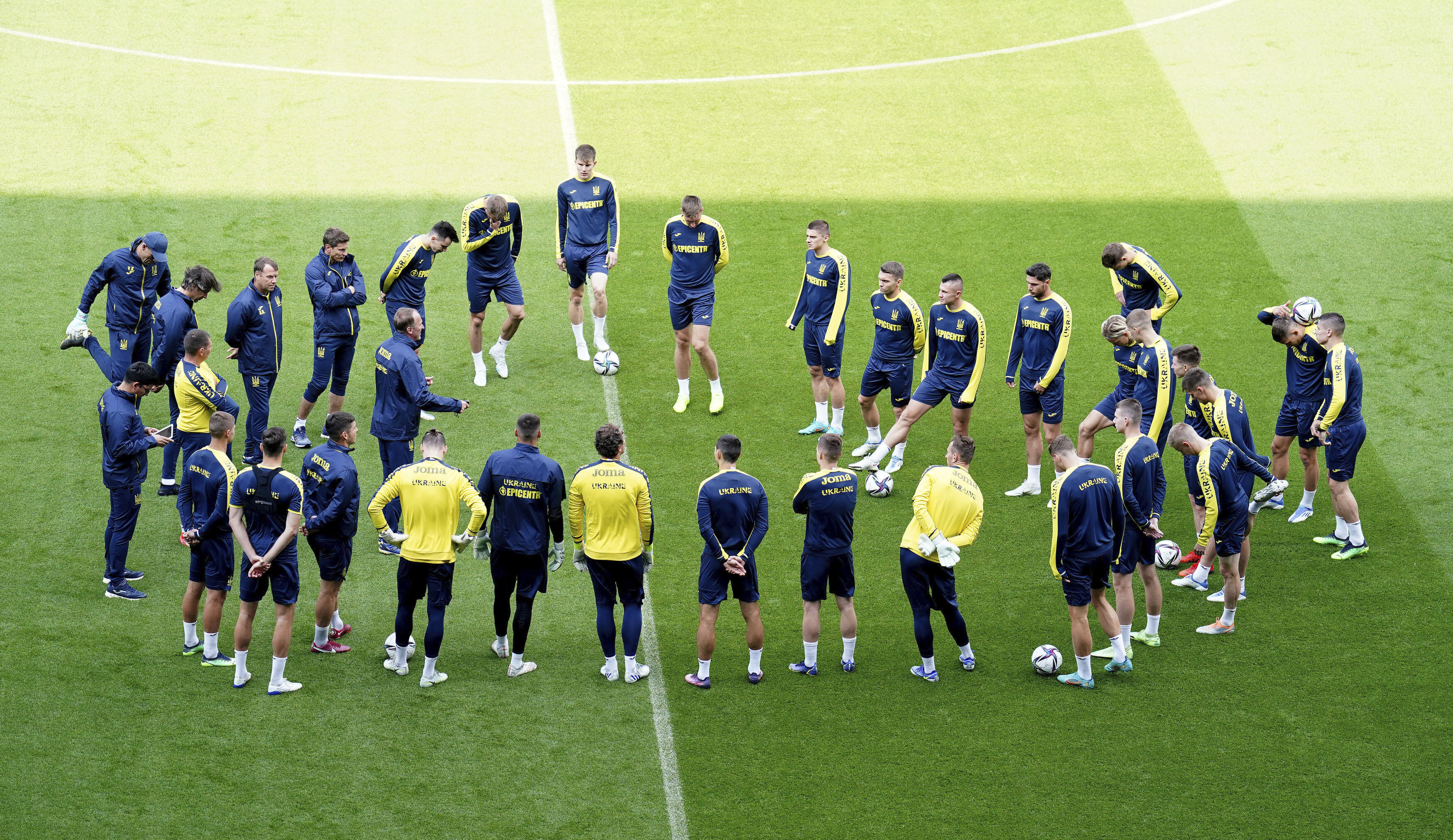 Ukraine players form a circle during a training session at the Cardiff City Stadium, Cardiff, Wales Saturday June 4, 2022, the day before the team play Wales in a World Cup play-off soccer match.  