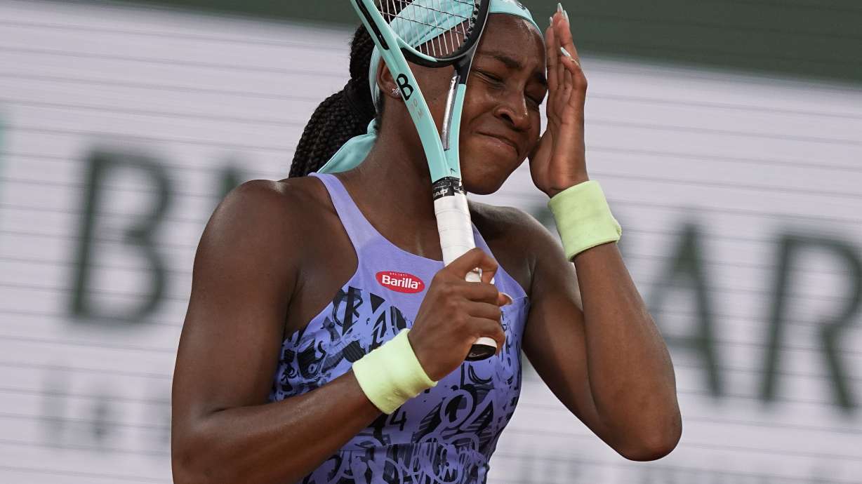 Coco Gauff of the U.S. reacts after missing a shot against Poland's Iga Swiatek during the final match at the French Open tennis tournament in Roland Garros stadium in Paris, France, Saturday, June 4, 2022.