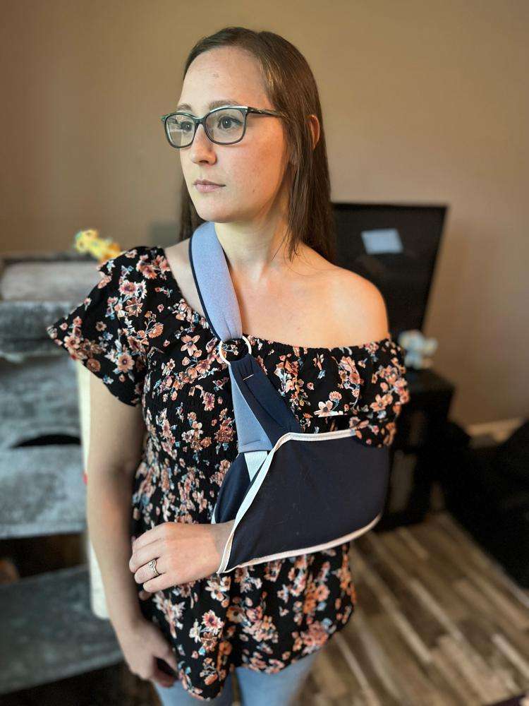 Rachel Davis poses May 22 in her home in Hendersonville, Tenn.. On May 11, Davis tackled an intruder to stop him from reaching students at her Inglewood Elementary School, resulting in her breaking her arm.